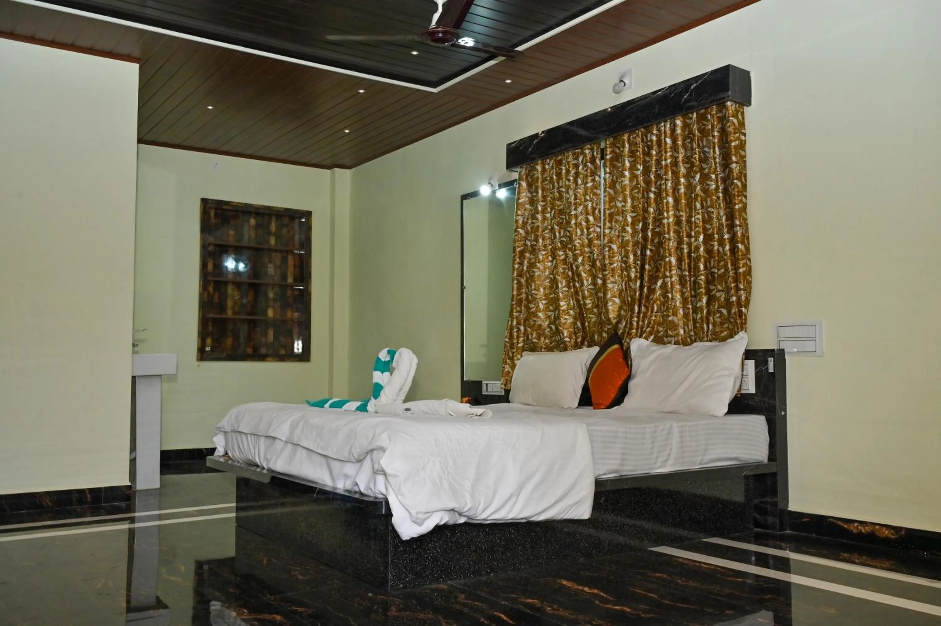 Bed in NAVARATHNA International resort
