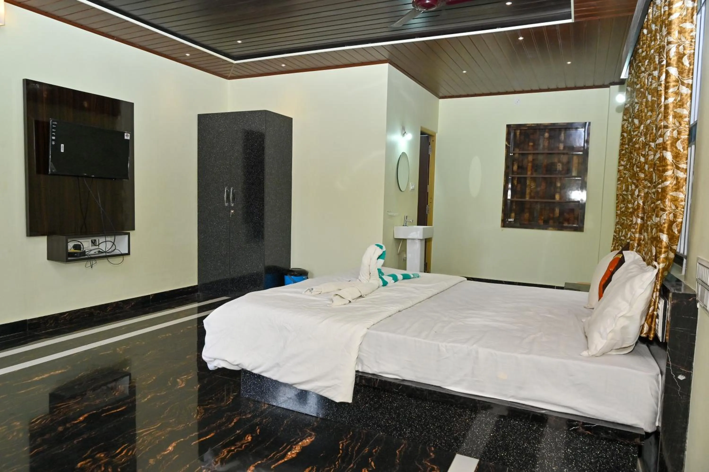 Bed in NAVARATHNA International resort