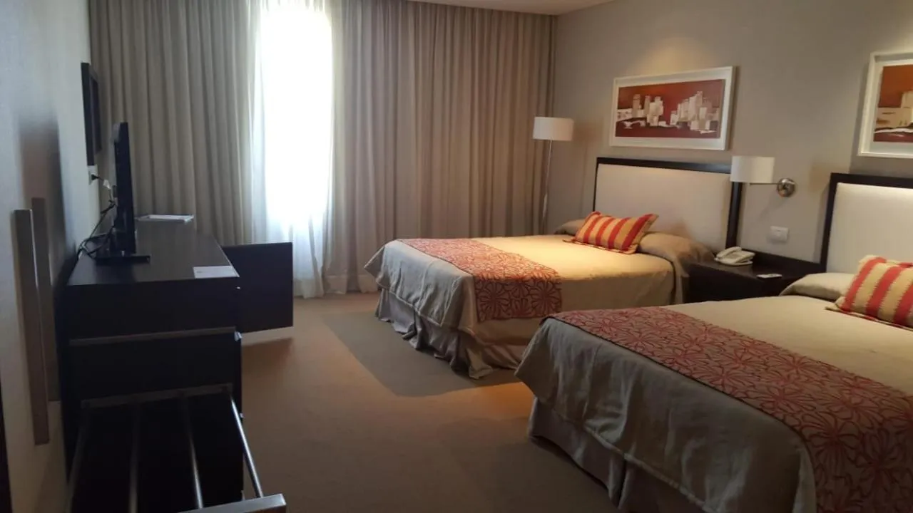 Bed in Howard Johnson Hotel Piedras Moras