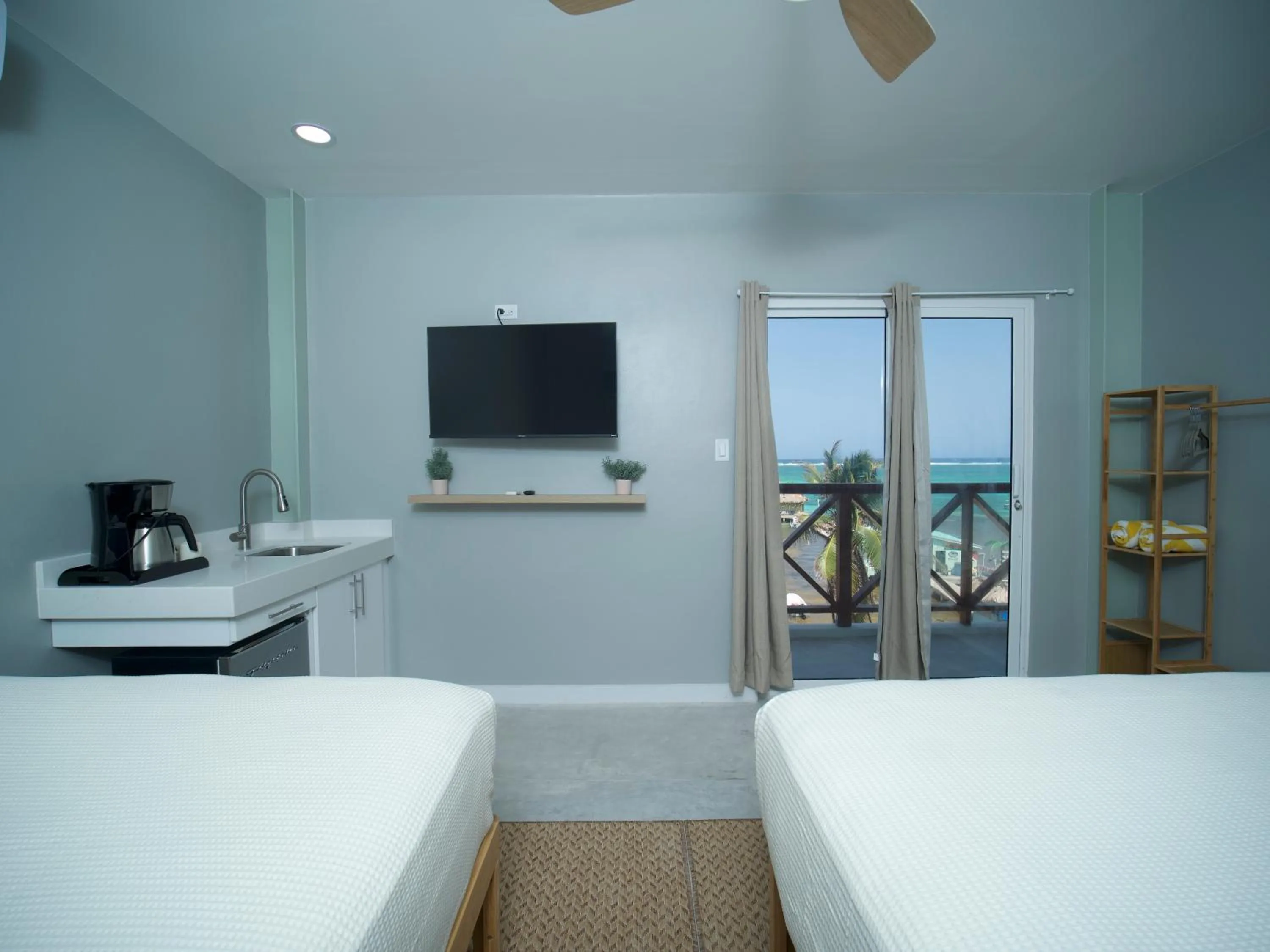 Photo of the whole room, Bed in Sandbar Beachfront Hotel & Hostel Restaurant