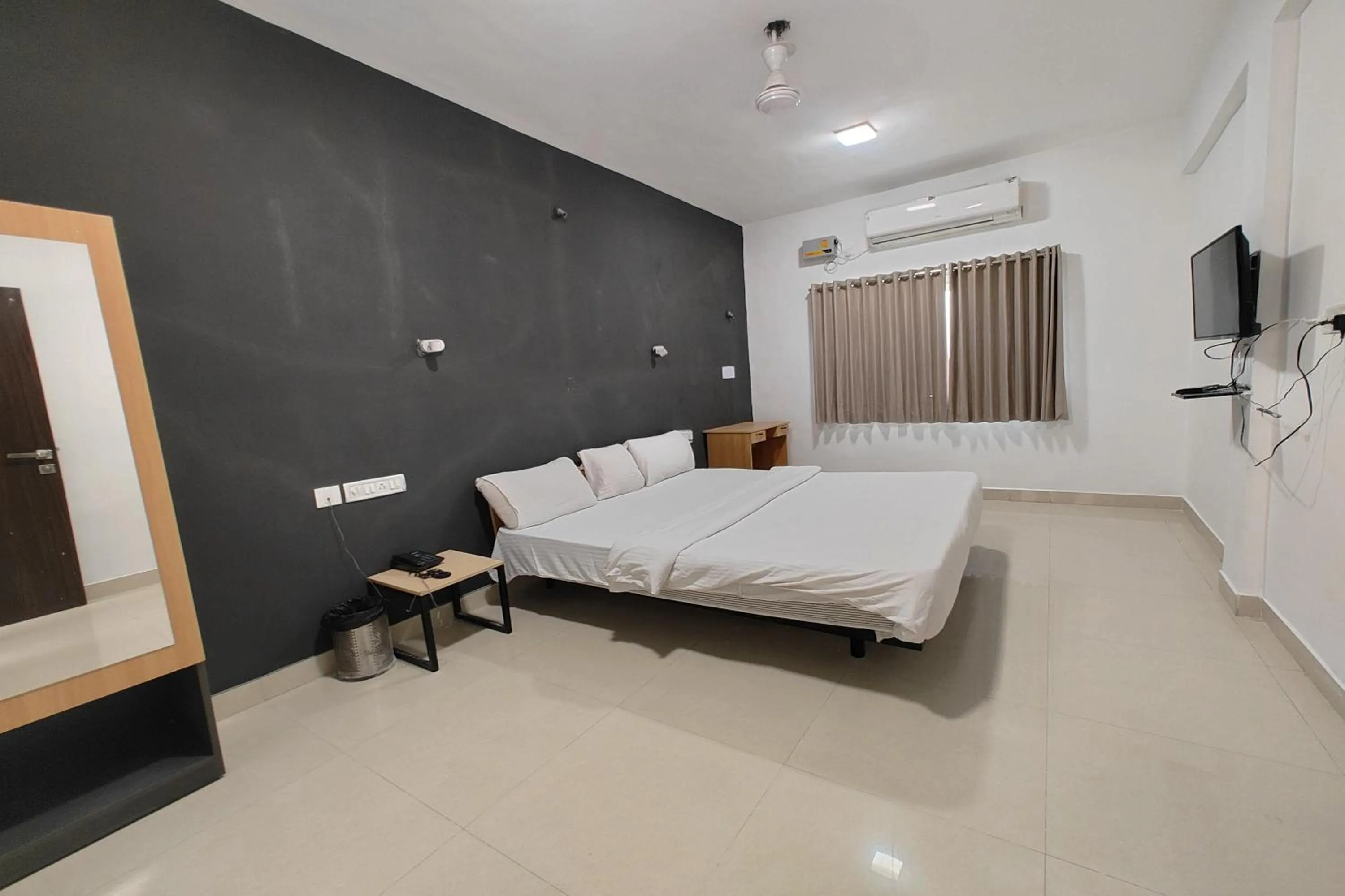 Bed in Hotel Sai Inn Executive