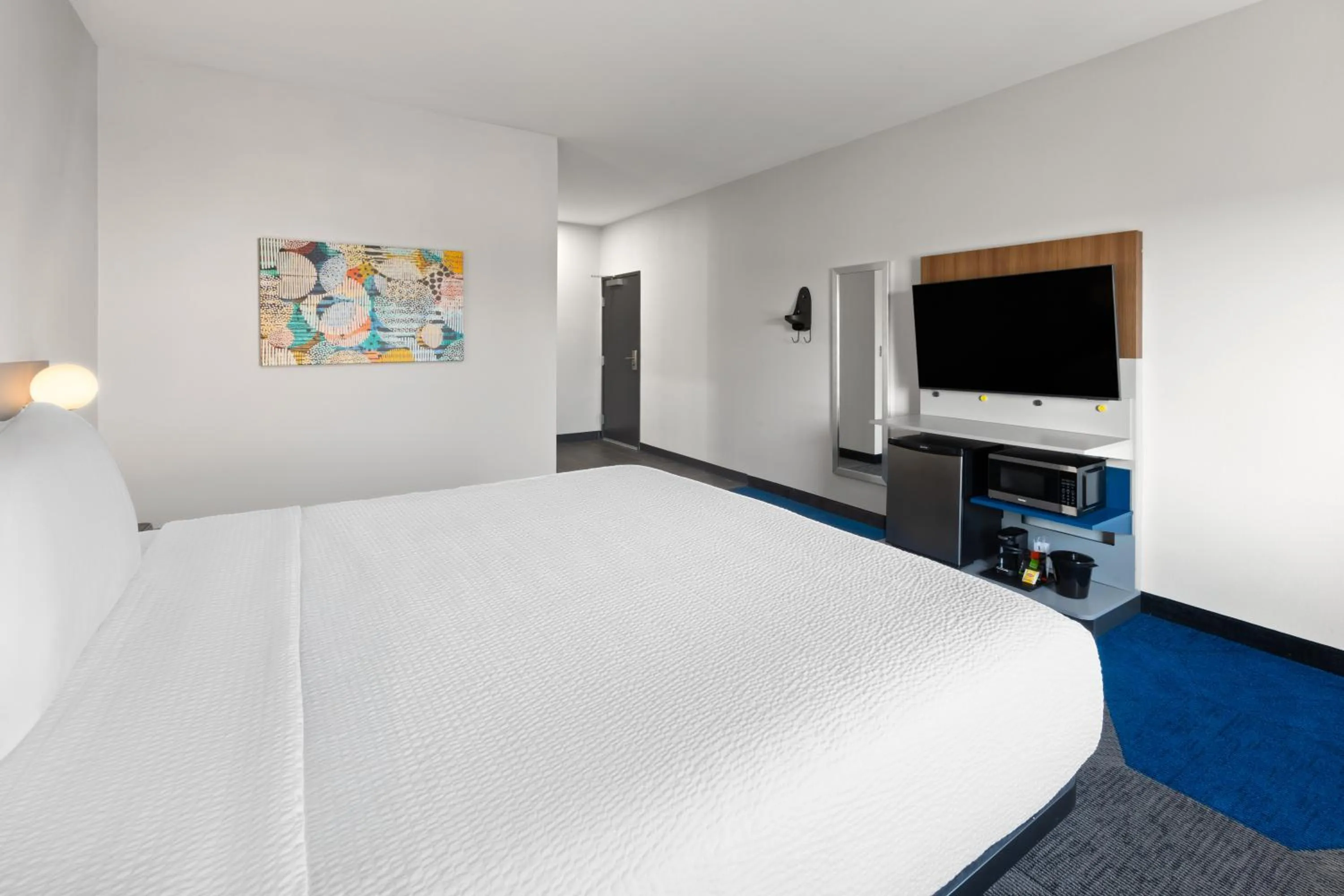 Bed in Microtel Inn & Suites by Wyndham Olive Branch