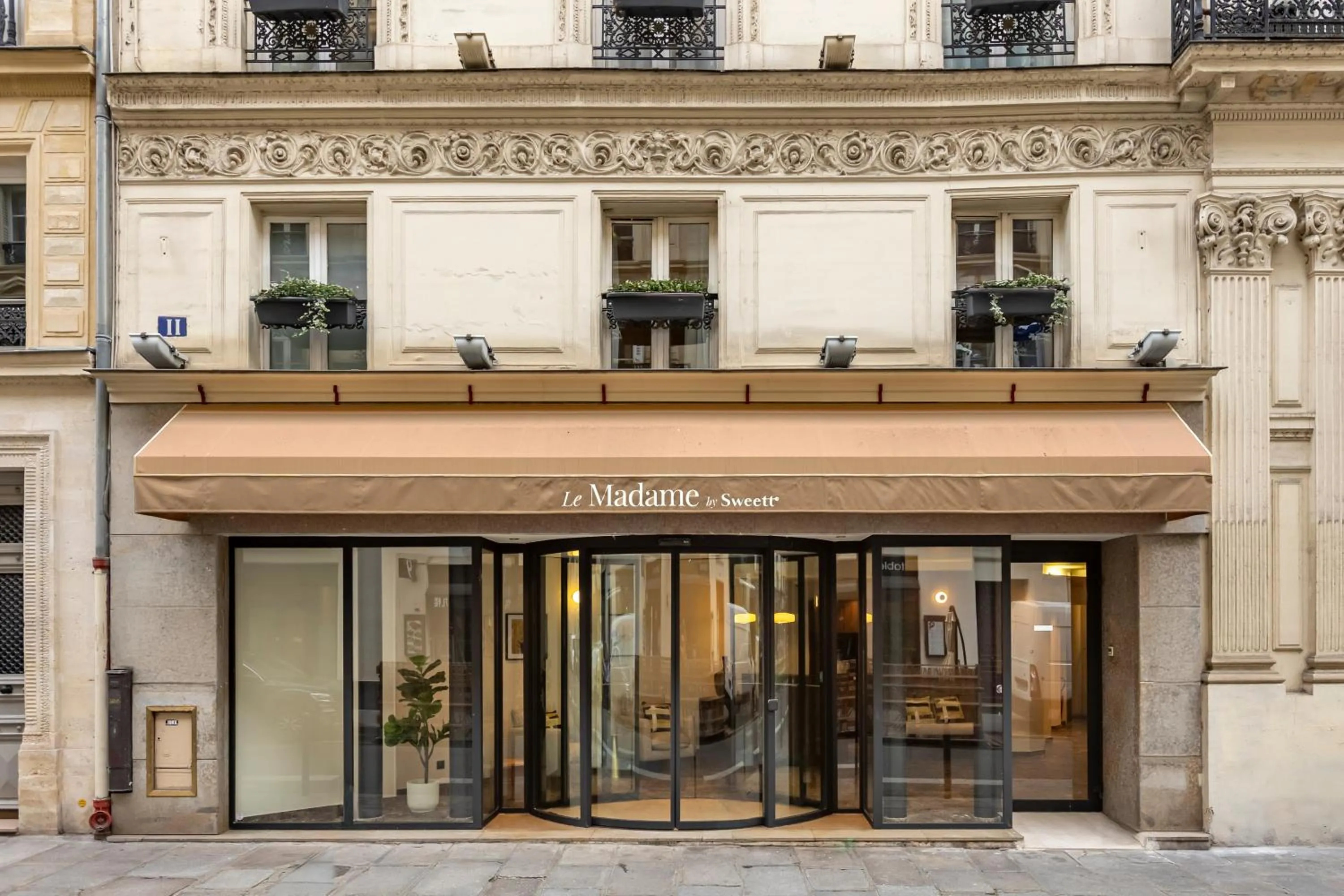 Property building in Le Madame By Sweett