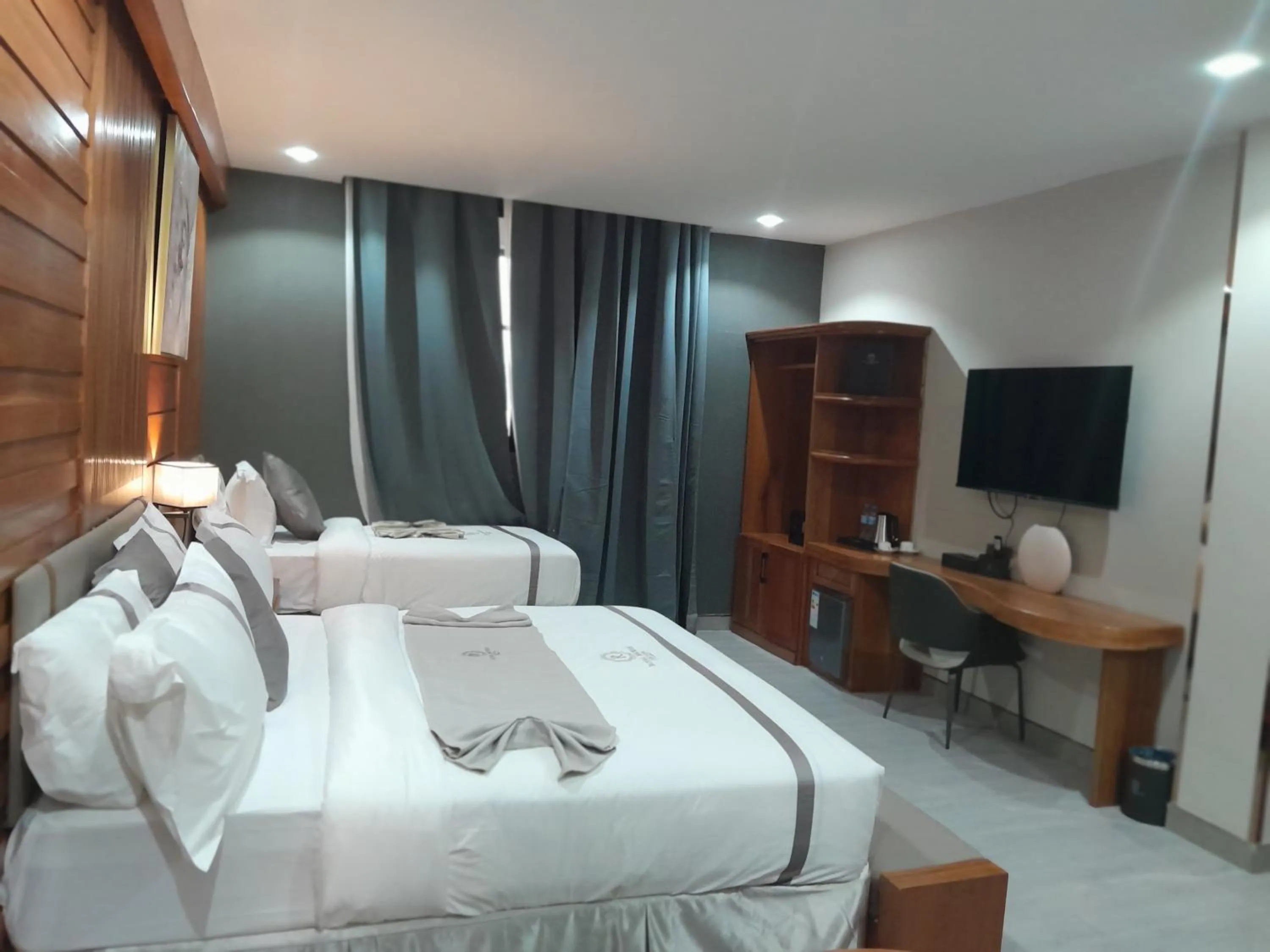 Communal lounge/ TV room, Bed in Royal Mgwasi Hotel