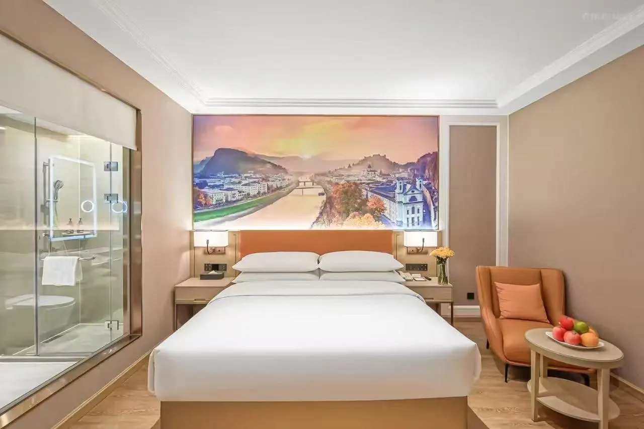 Bed in Vienna Hotel Jiangjin Wanda Plaza Shengquansi Subway Station