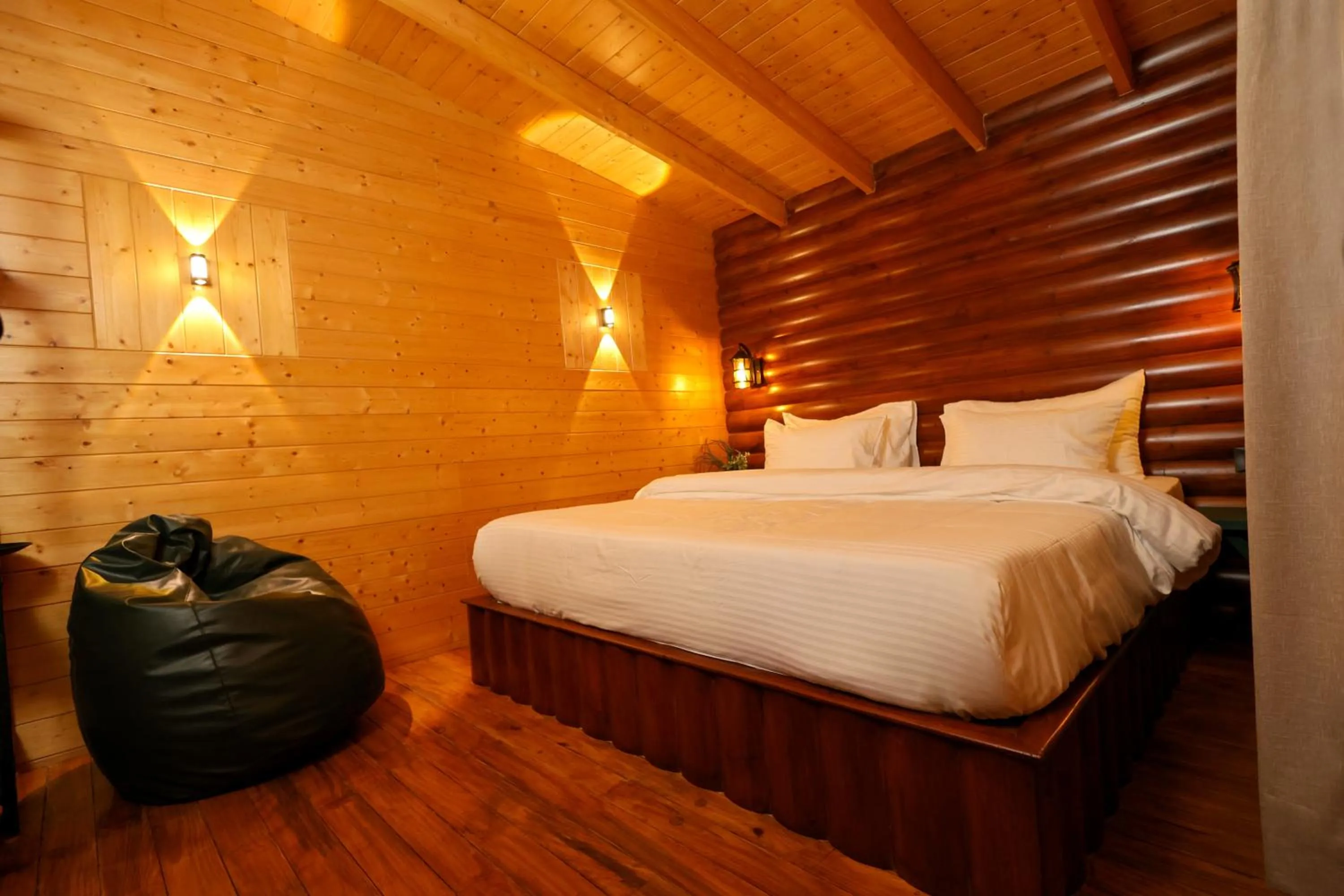 Bed in Koro Treehouse Resort Luxury Wooden Cottages and Villas with Private Pool