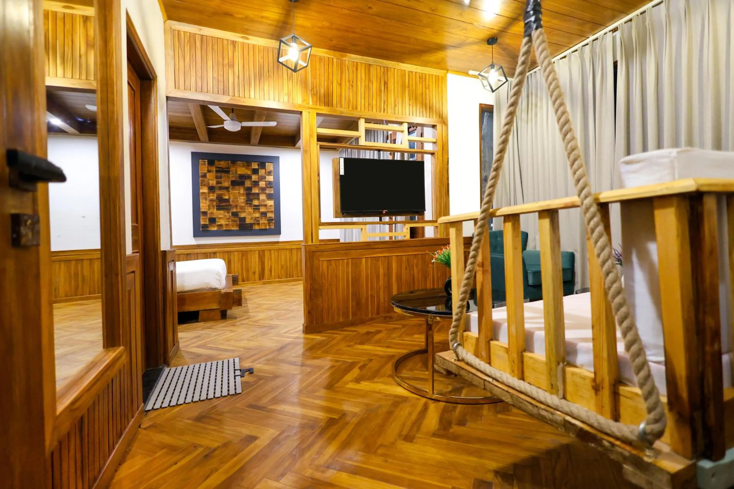 Communal lounge/ TV room in Koro Treehouse Resort Luxury Wooden Cottages and Villas with Private Pool