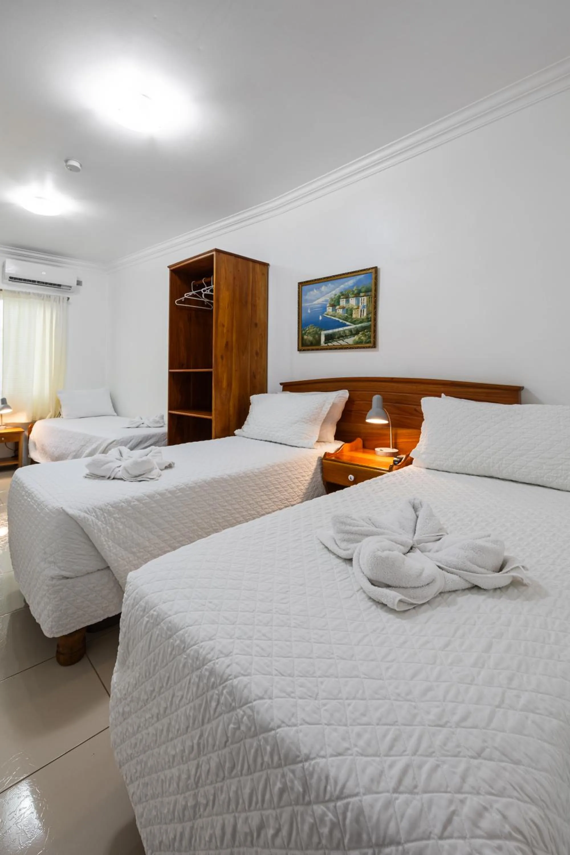 Bed in La Peregrina Galapagos B&B