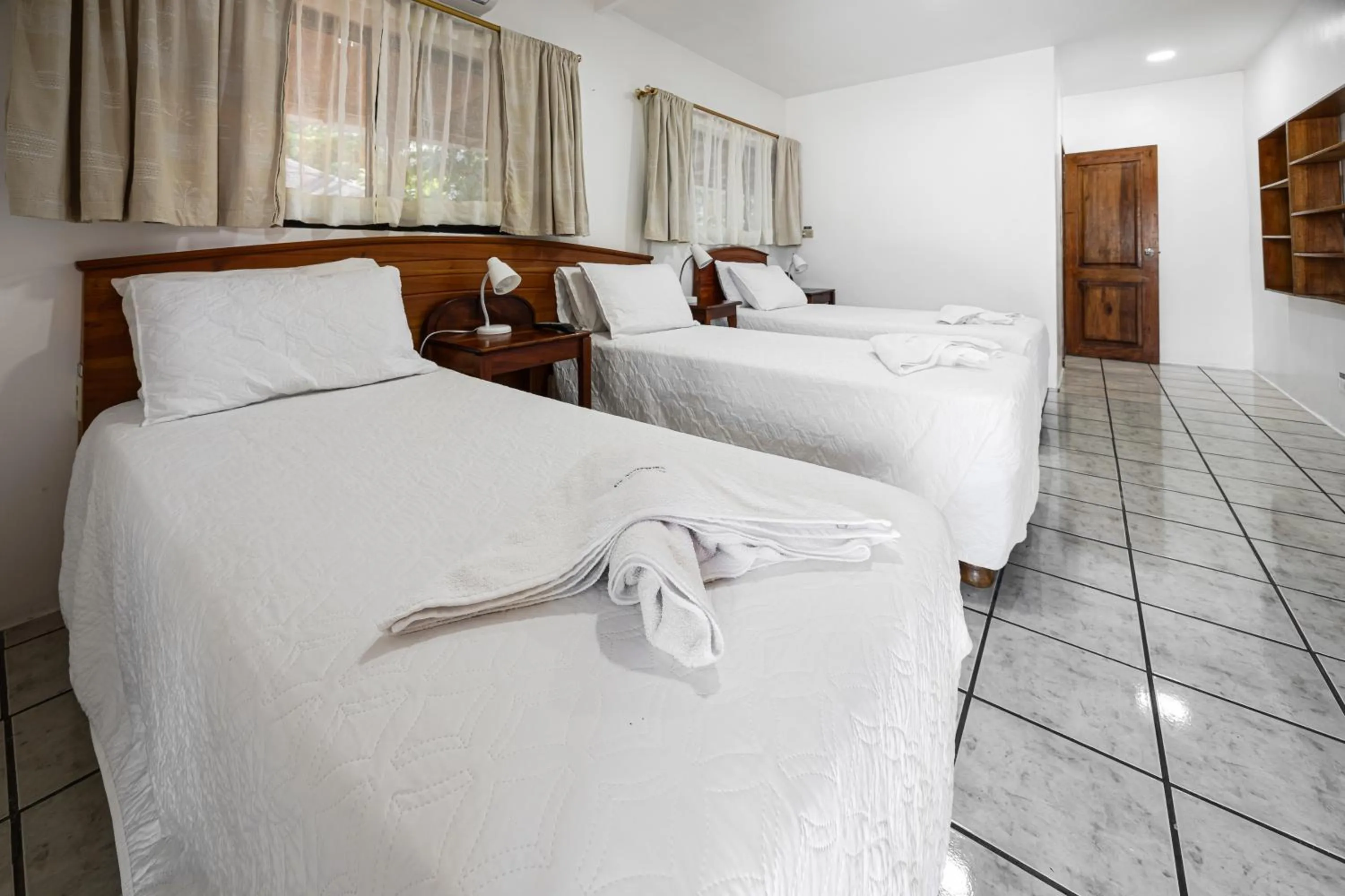 Bed in La Peregrina Galapagos B&B