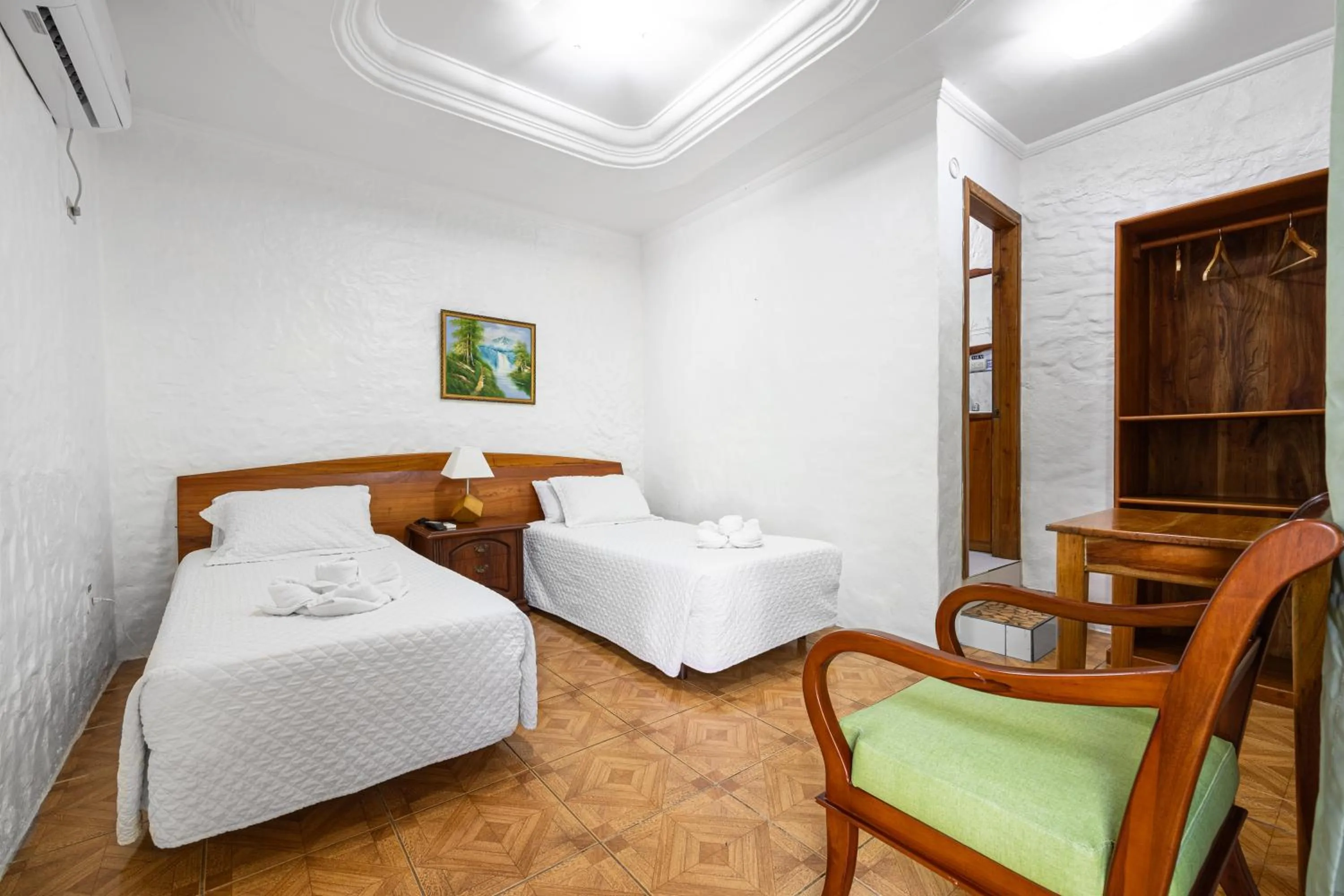 Bed in La Peregrina Galapagos B&B