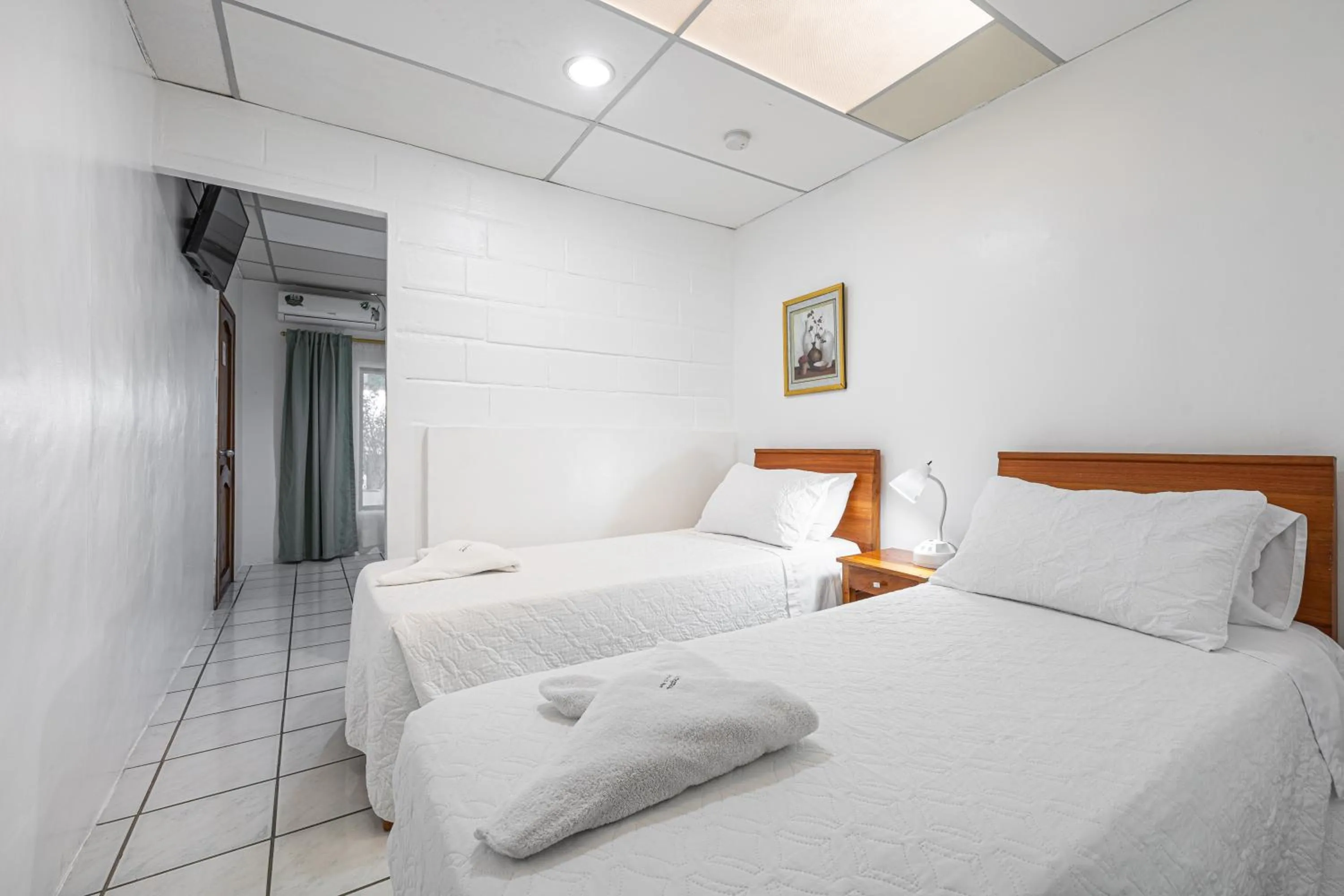 Bed in La Peregrina Galapagos B&B