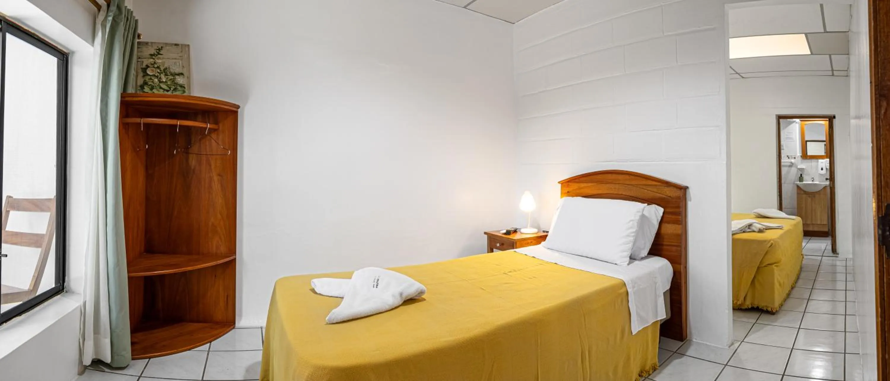 Bed in La Peregrina Galapagos B&B