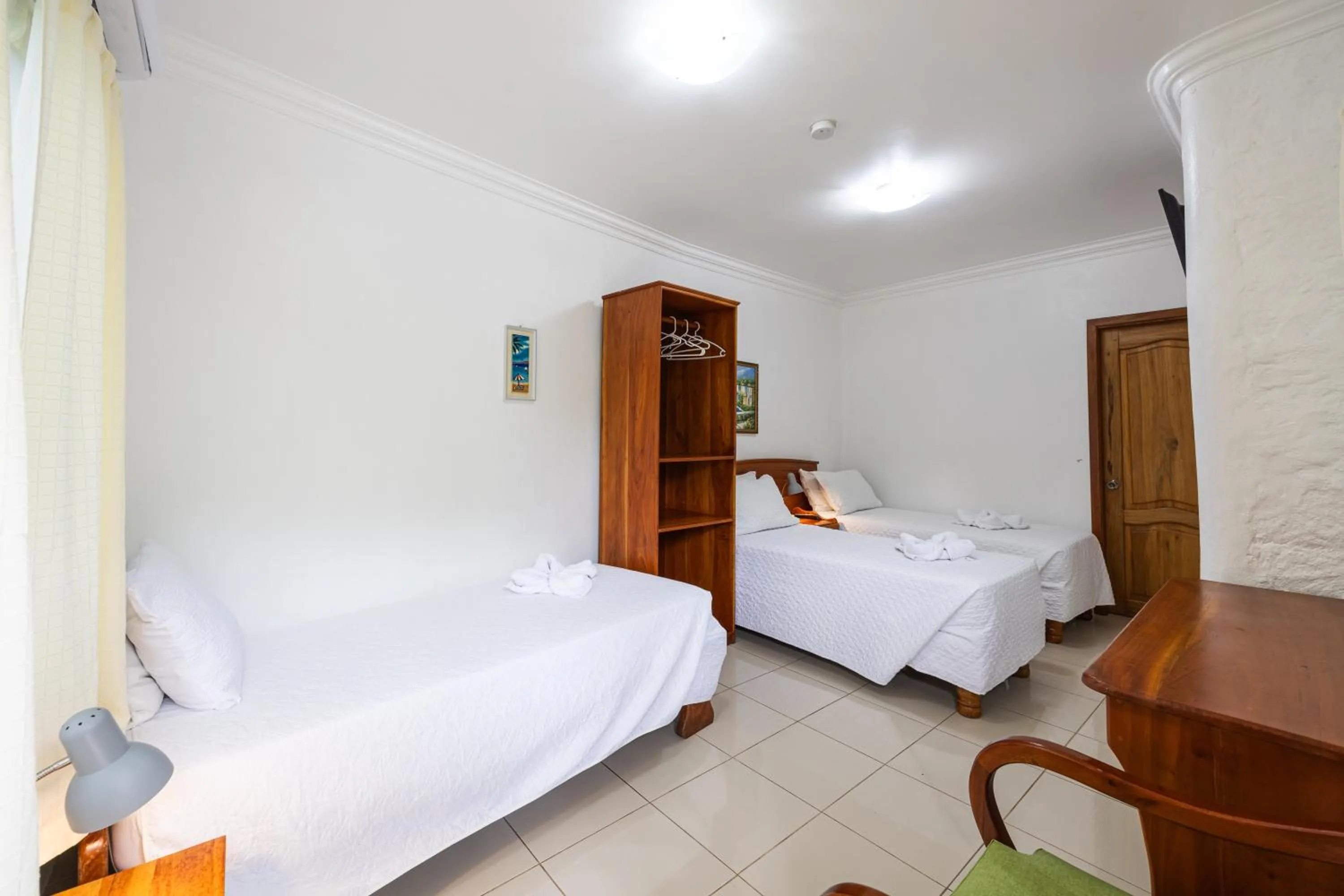 Bed in La Peregrina Galapagos B&B