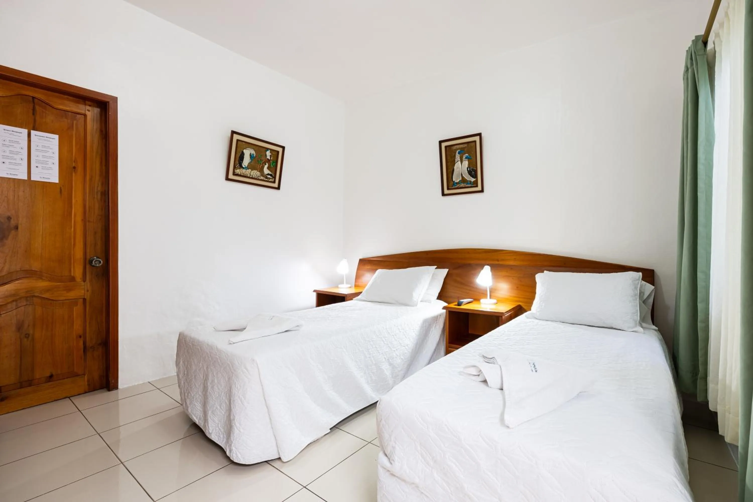 Bed in La Peregrina Galapagos B&B