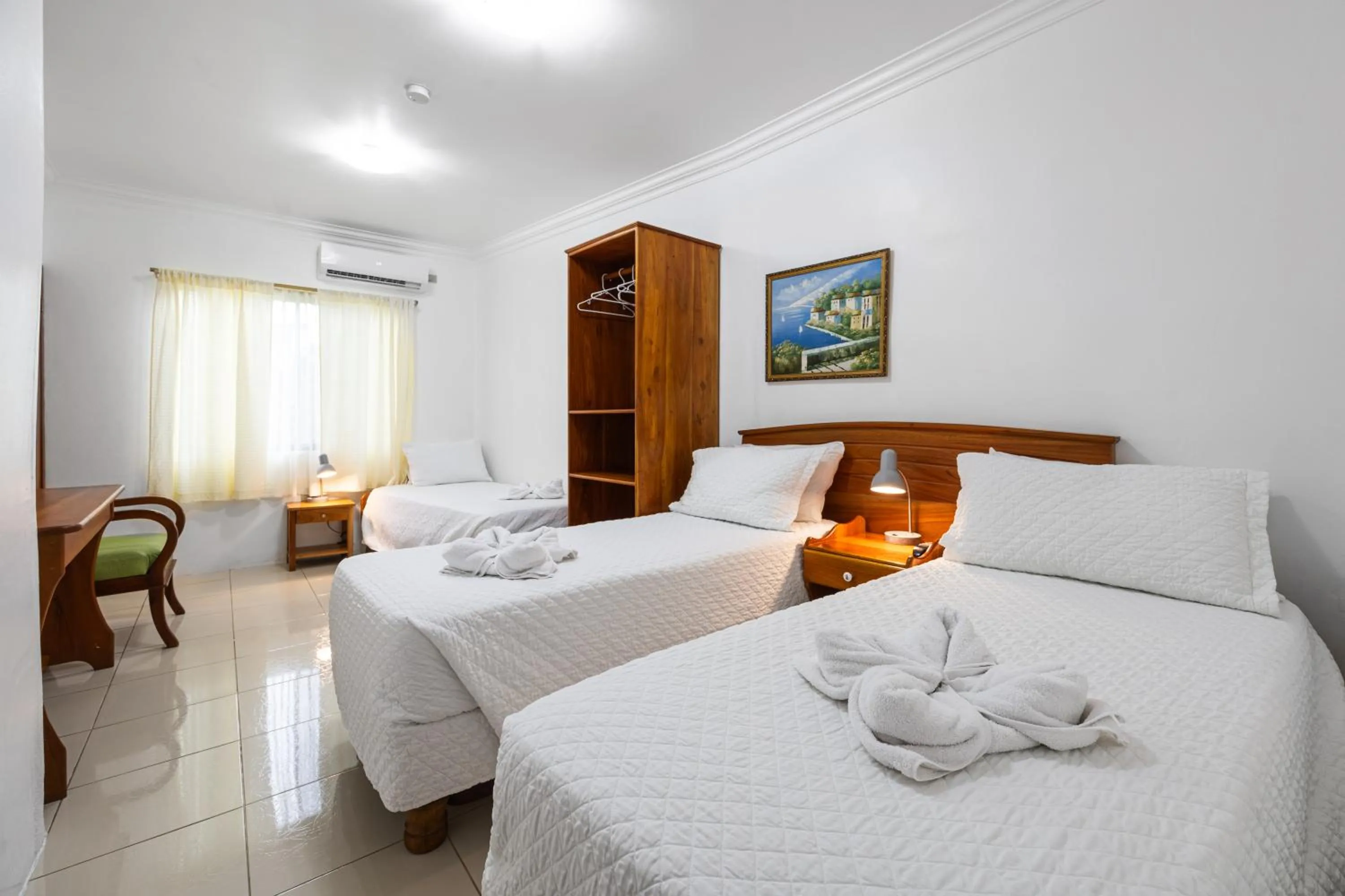 Bed in La Peregrina Galapagos B&B