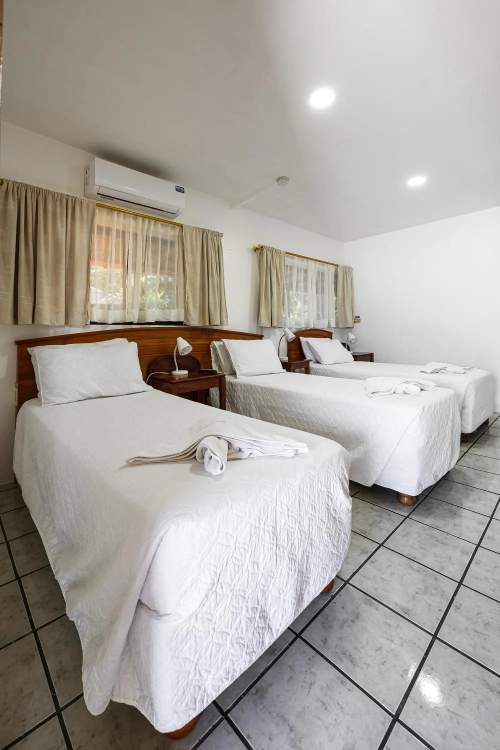 Bed in La Peregrina Galapagos B&B