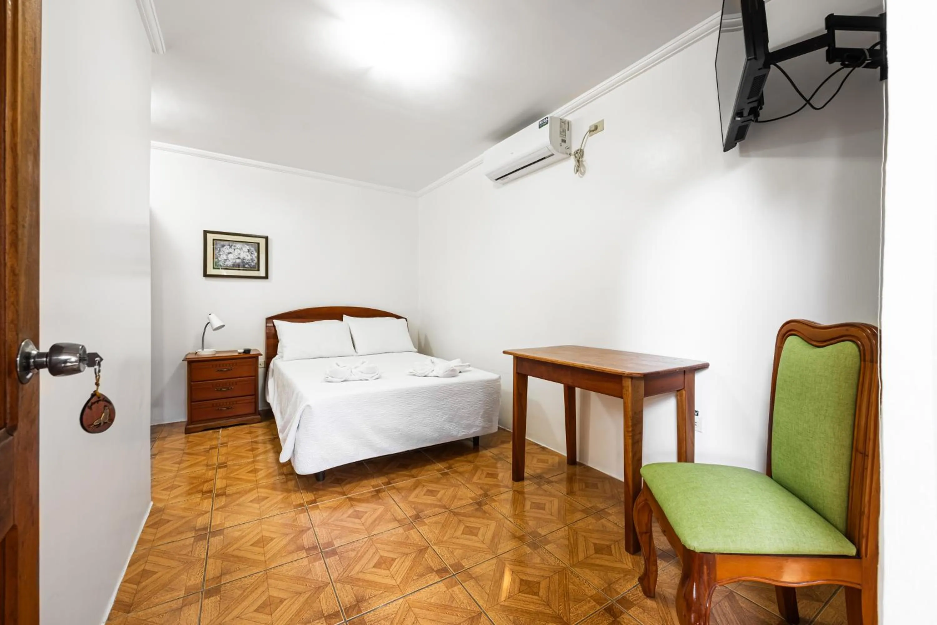 Bed in La Peregrina Galapagos B&B