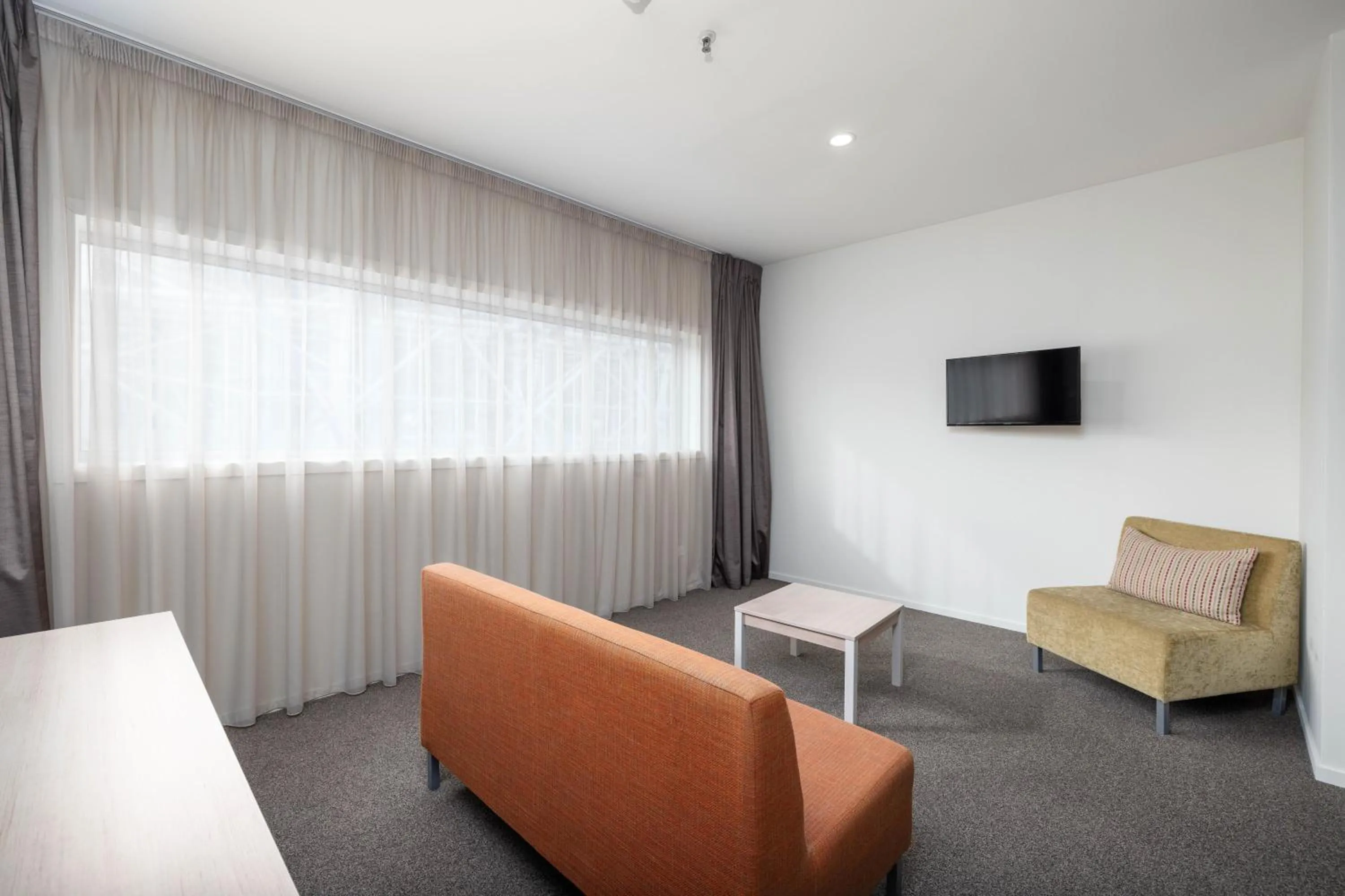 Living room in Ramada Suites by Wyndham Christchurch City