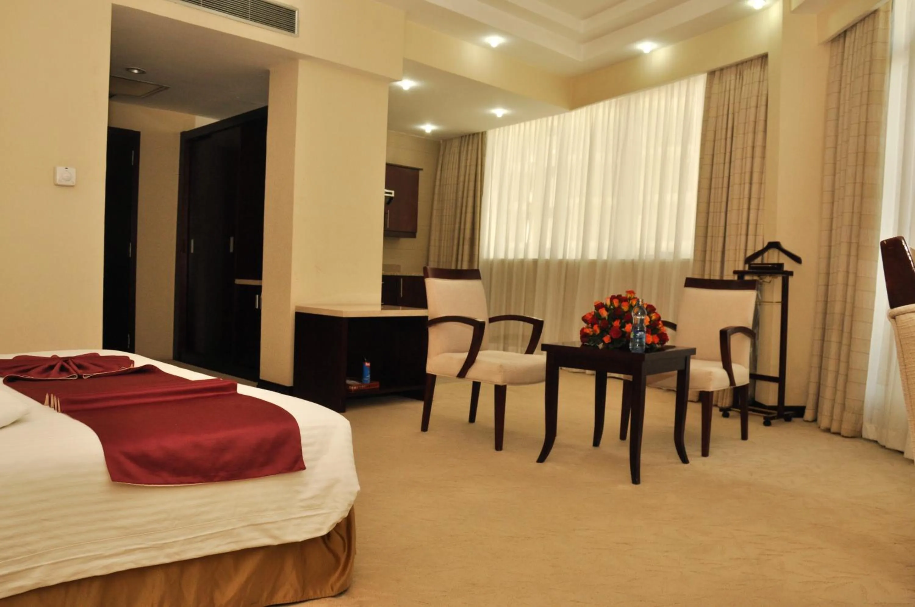 Seating area, Bed in Harmony Hotel