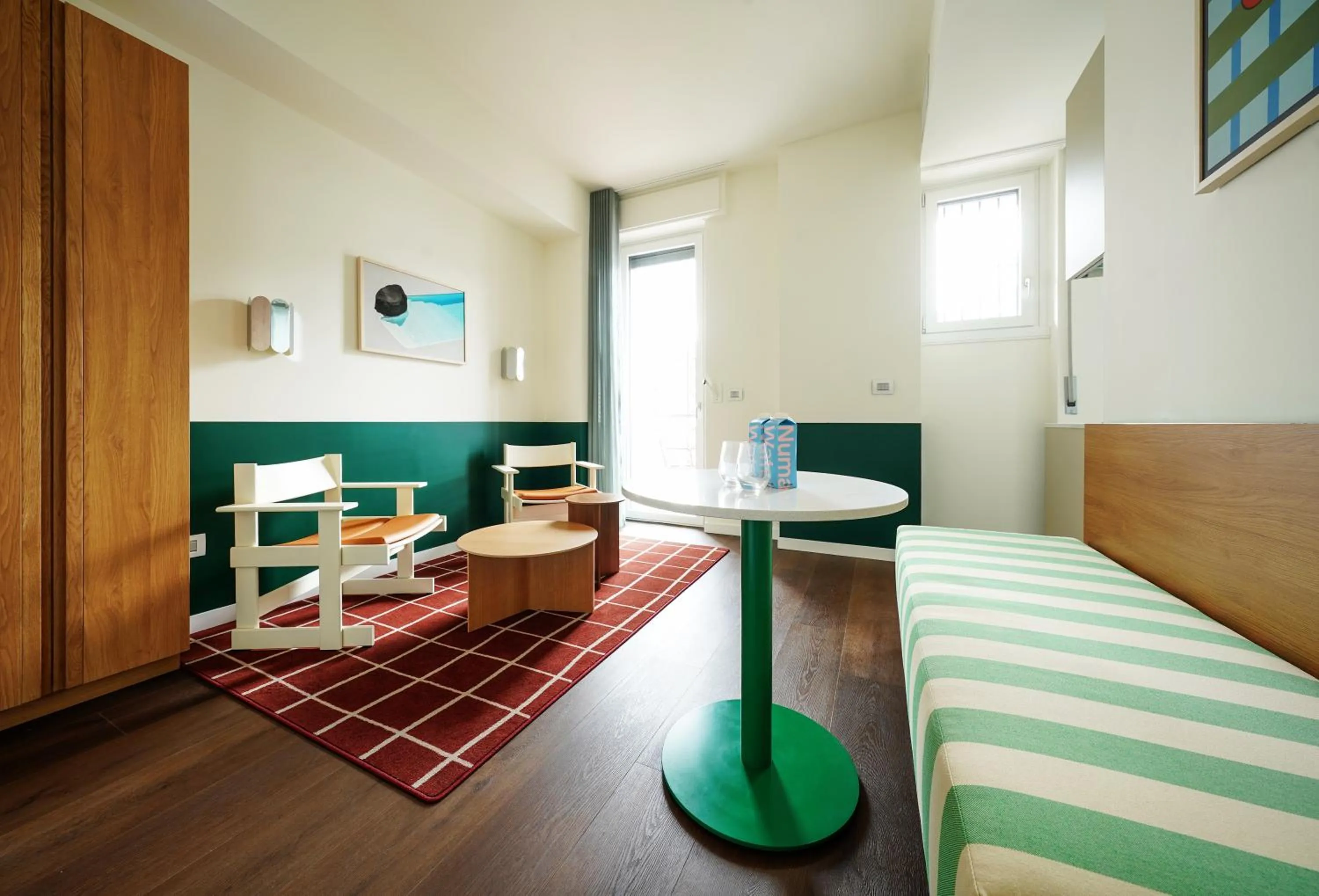 Living room, Bed in Numa Milan Sempione