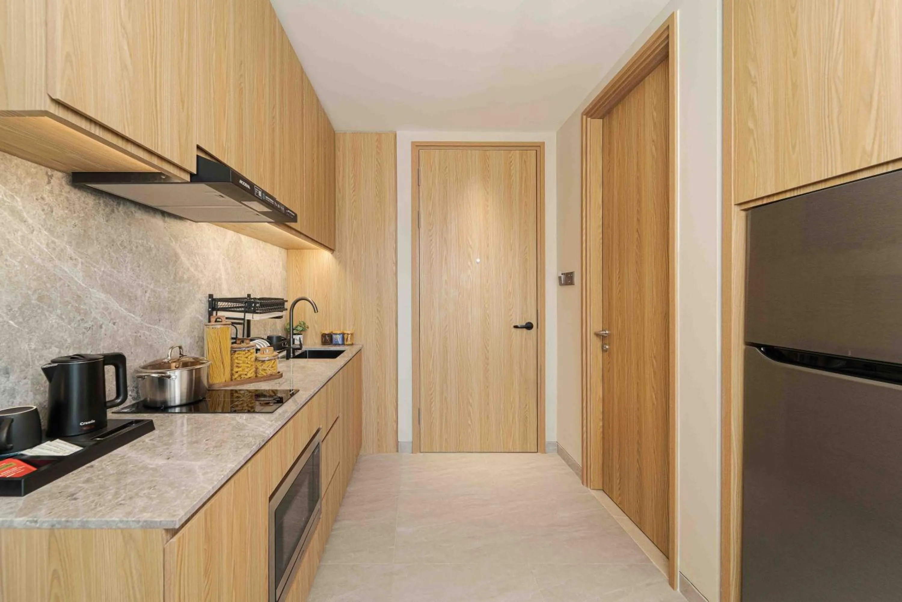 Kitchen or kitchenette in Oakwood Hotel & Apartments Grand Batam