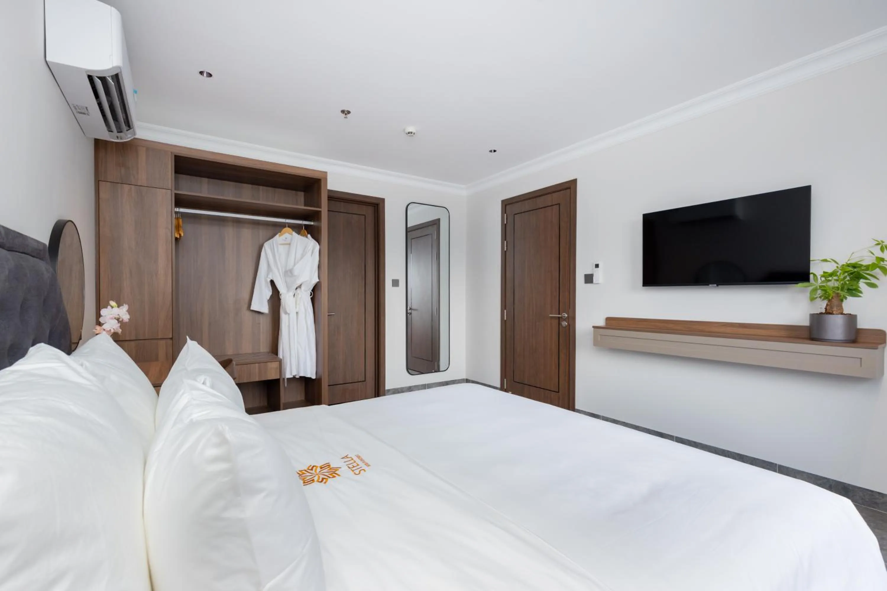 Bed in STELLA Hotel & Apartment