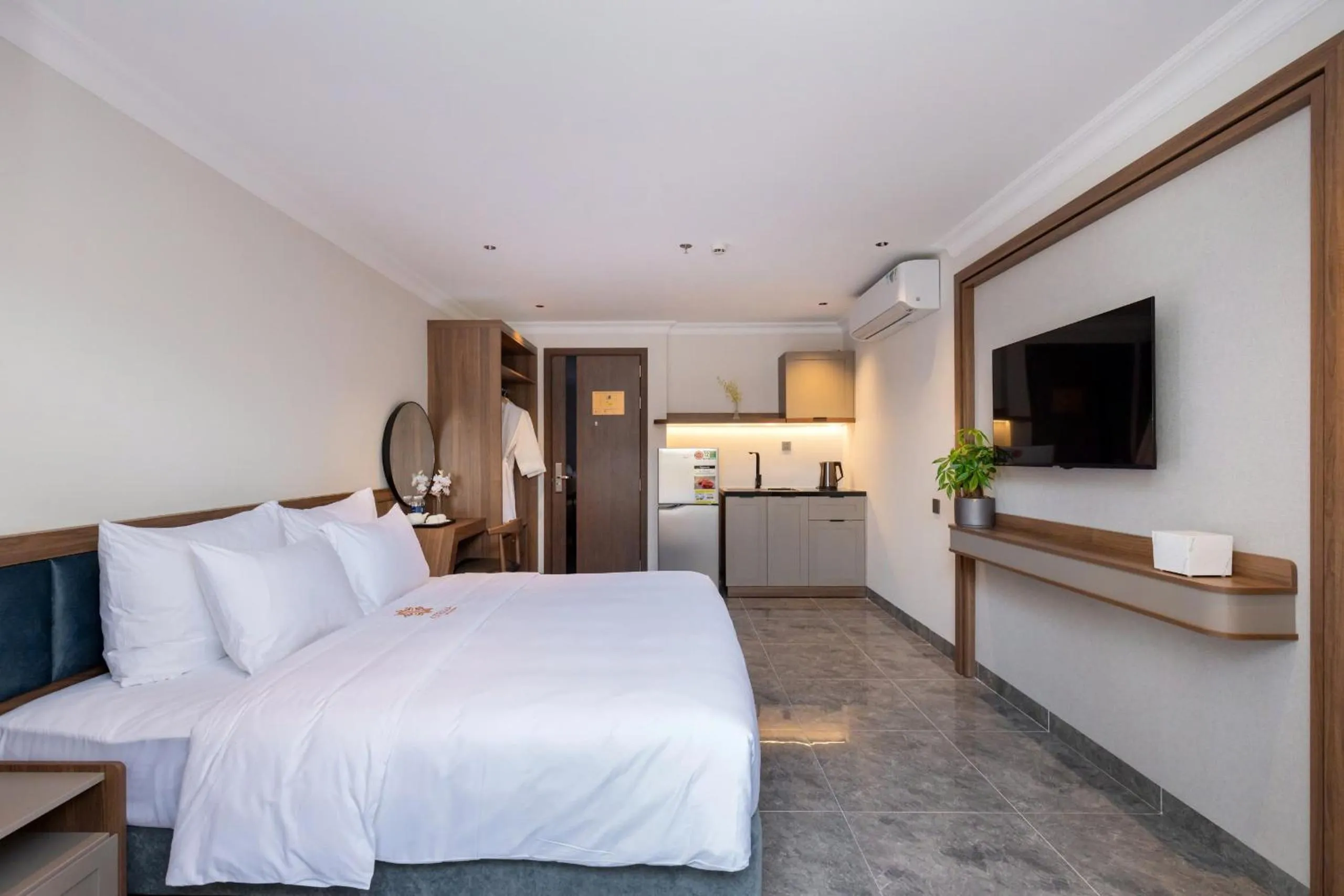 Kitchen or kitchenette, Bed in STELLA Hotel & Apartment