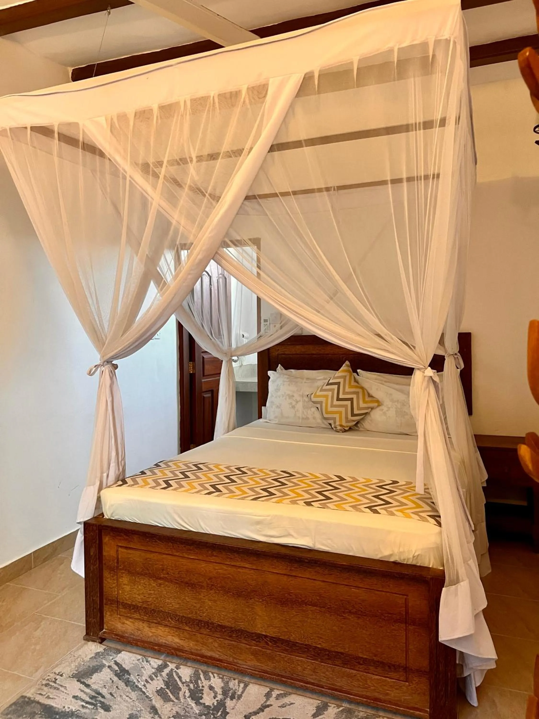 Bed in Zanzibar Bahari Villas