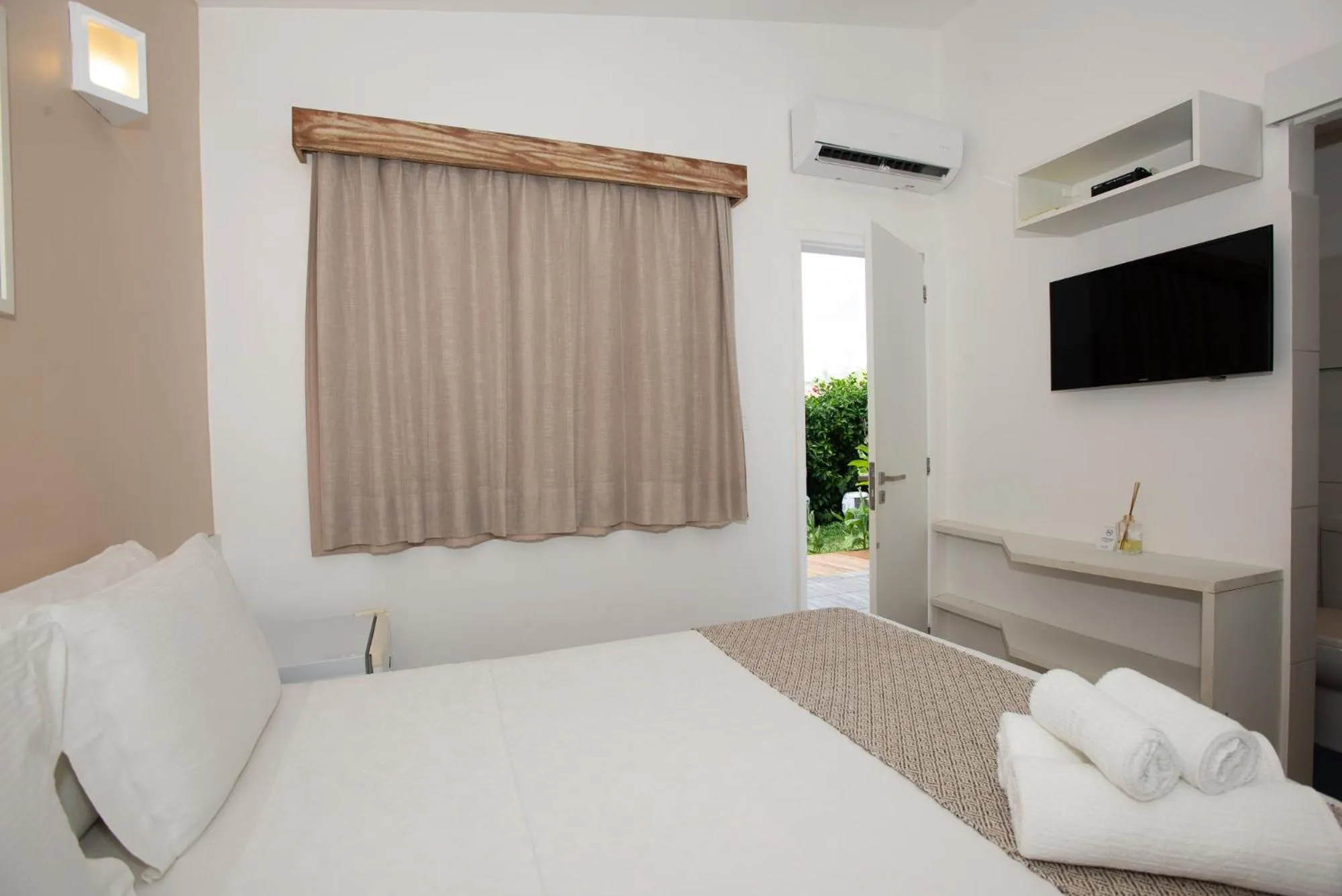 Bed in Pousada Malibu