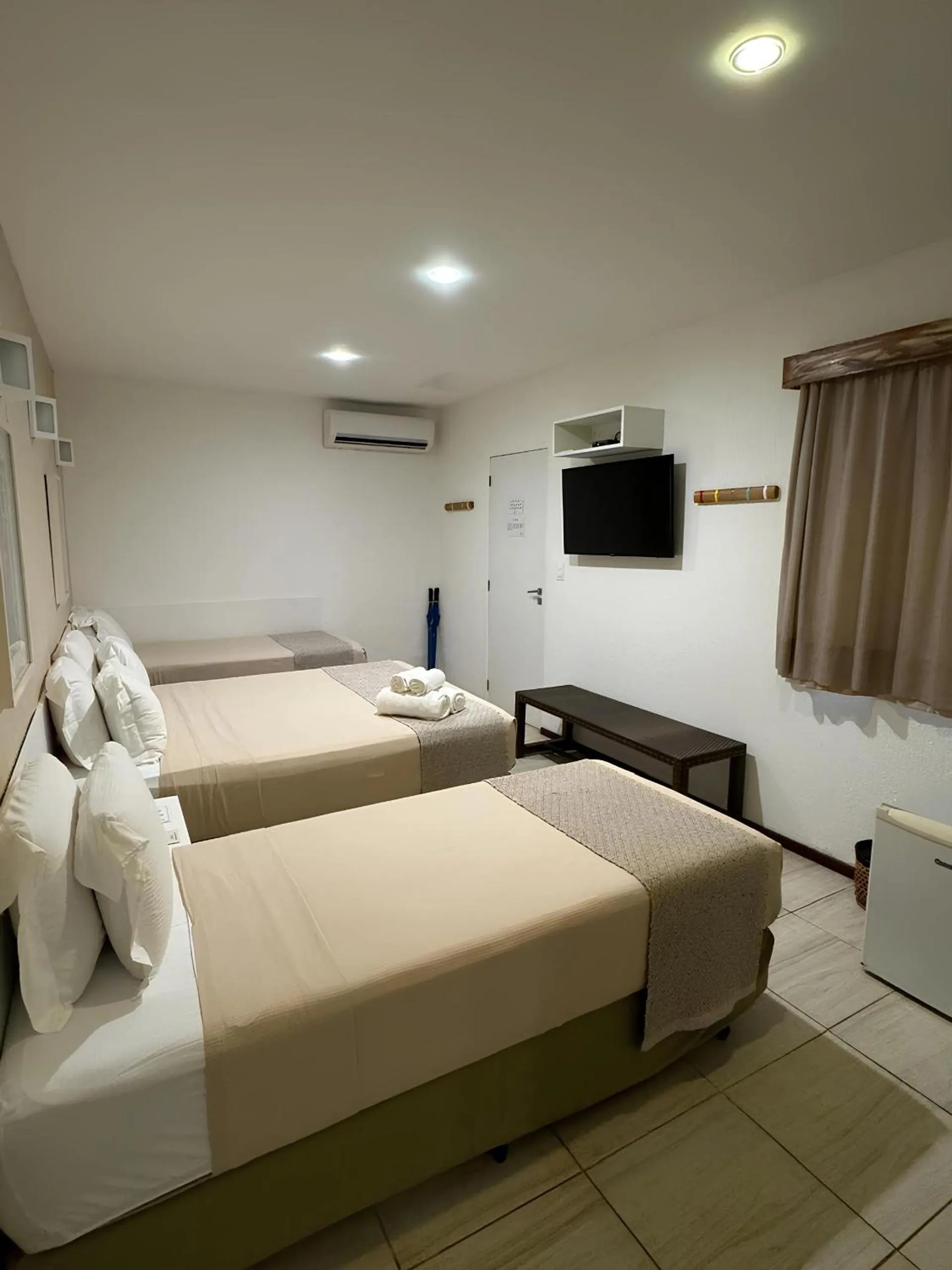 Bed in Pousada Malibu