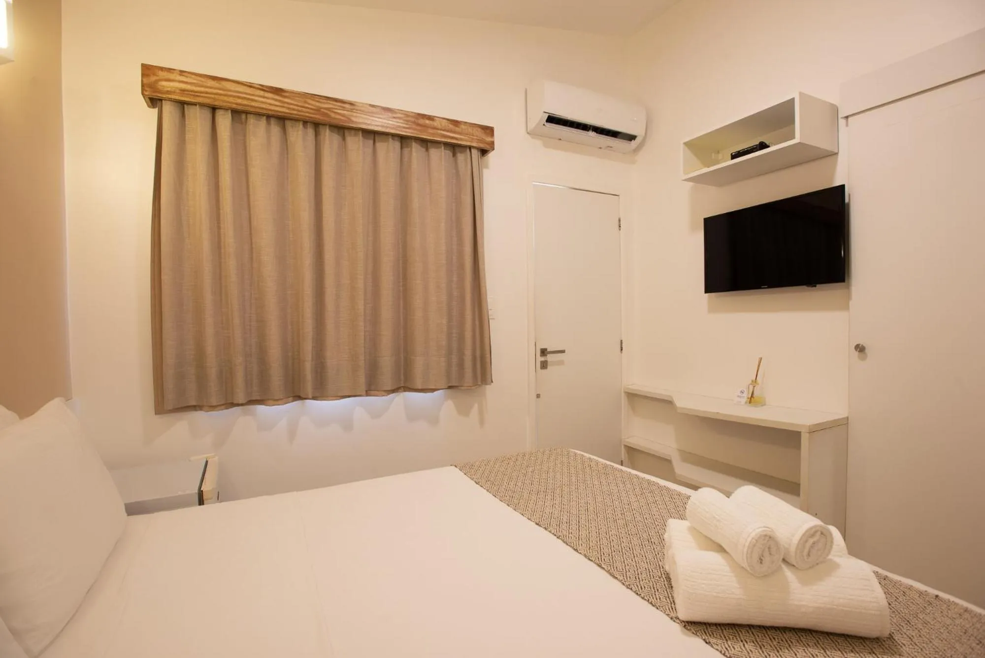 Bed in Pousada Malibu