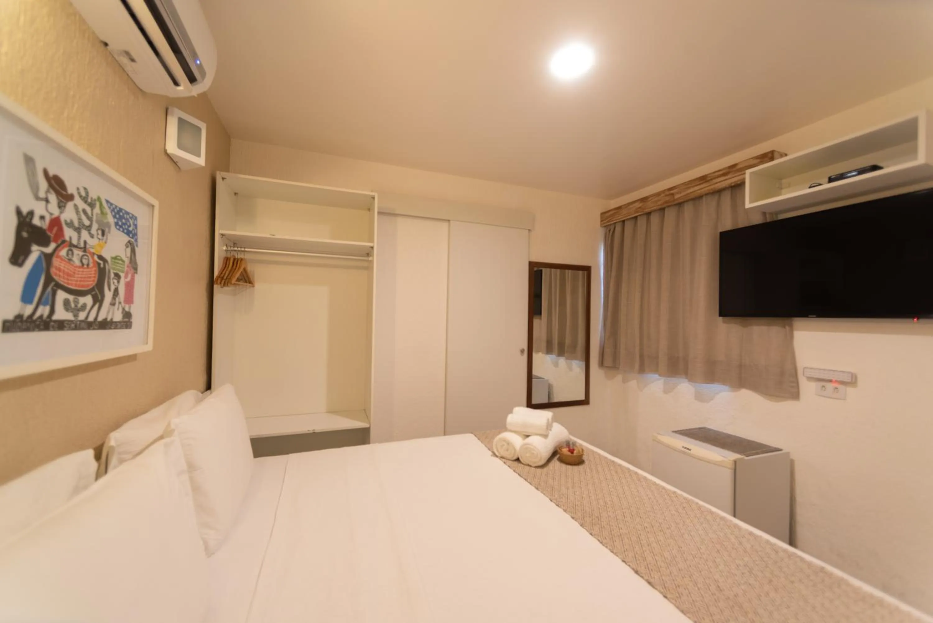 Bed in Pousada Malibu