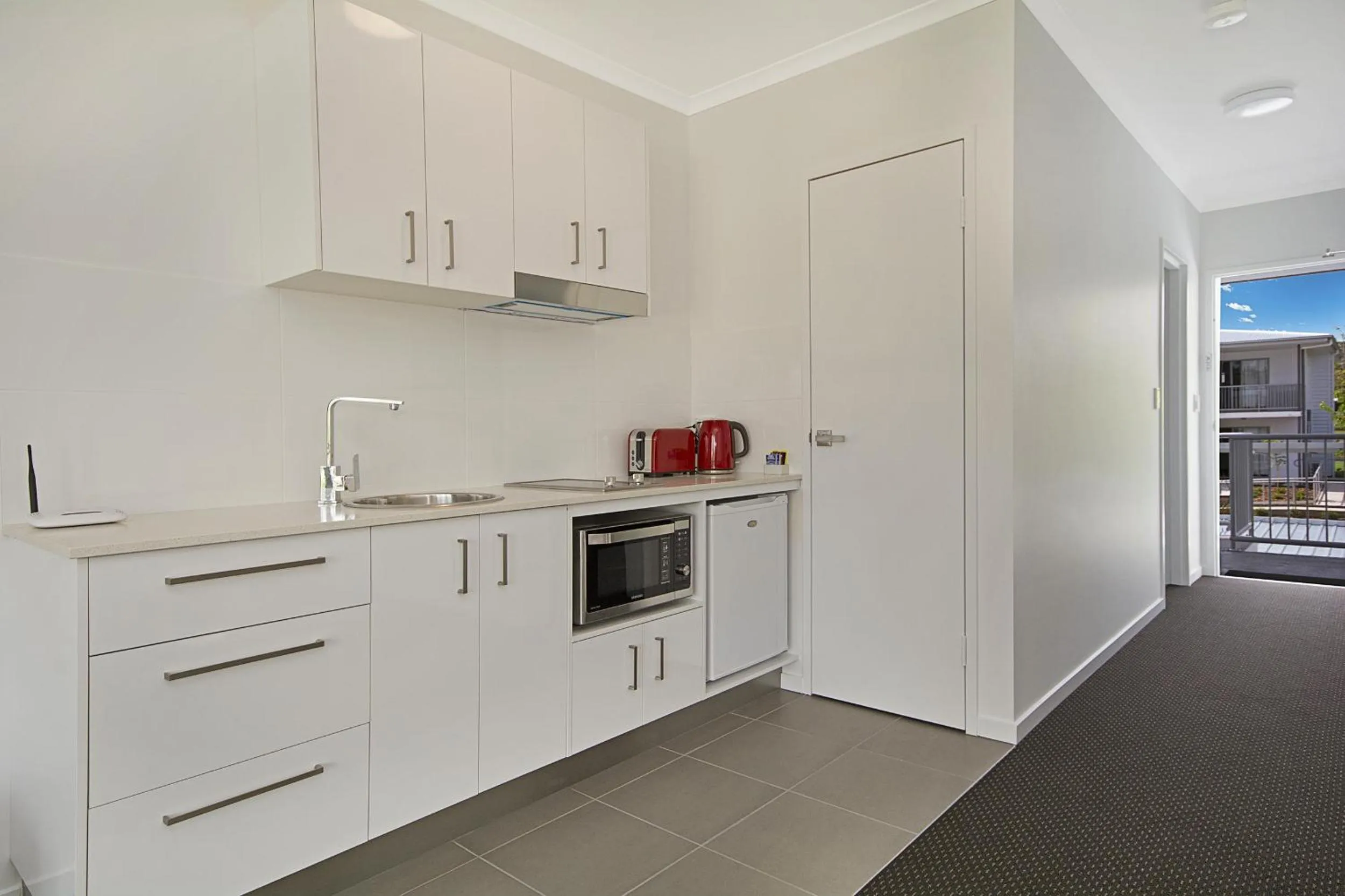 Kitchen or kitchenette in Cooroy Luxury Motel Apartments