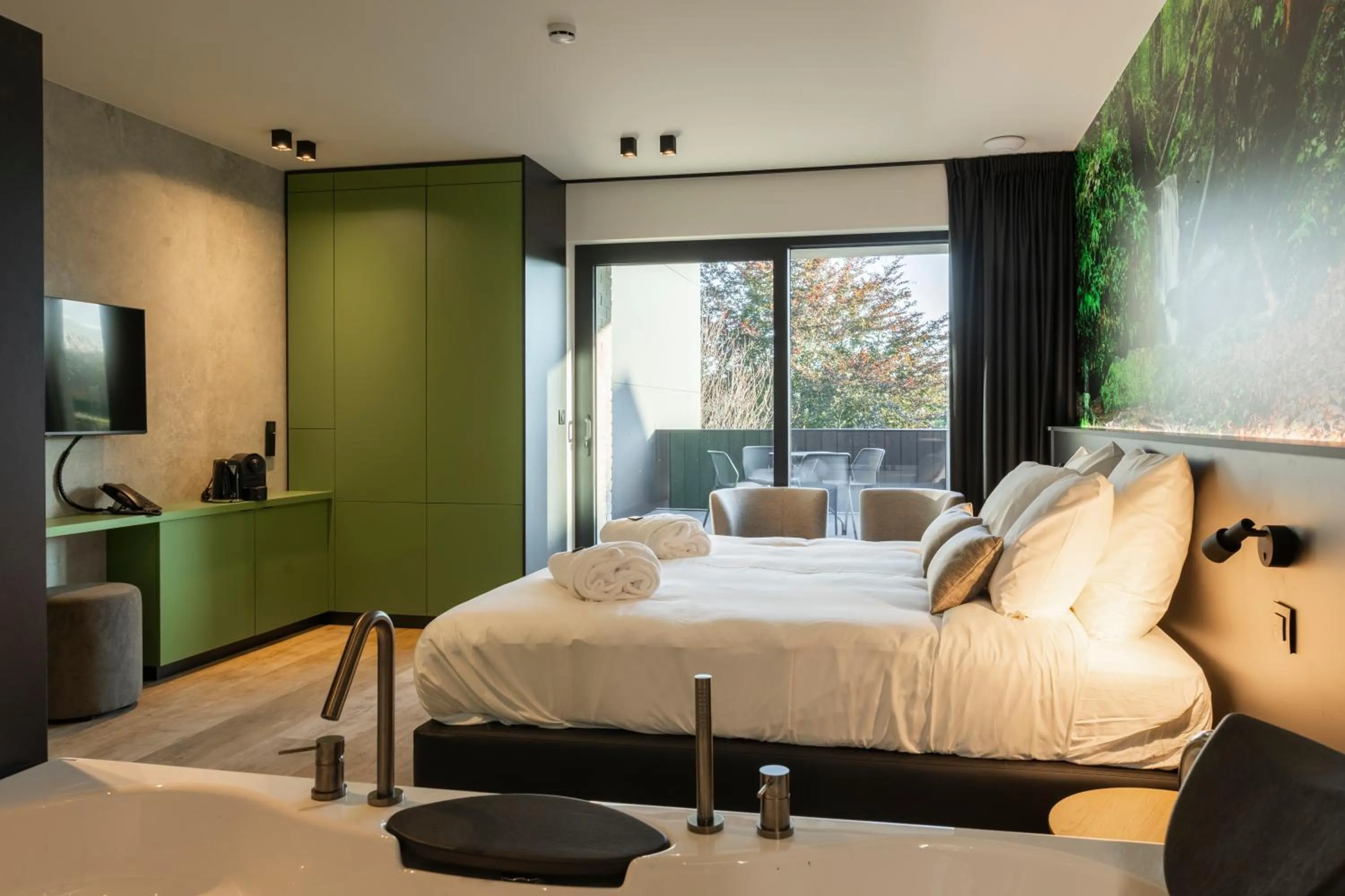 Bed in CC Nomie Hôtel Restaurant