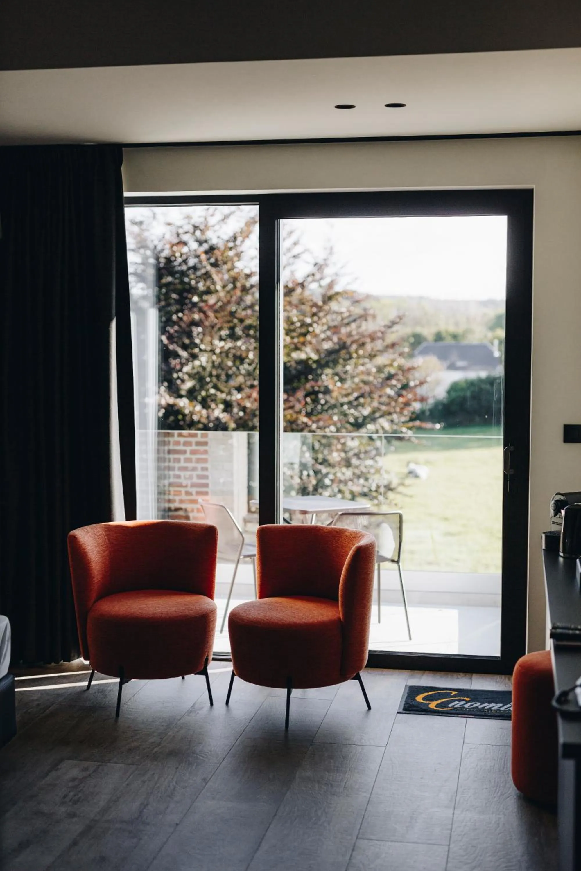 Seating area in CC Nomie Hôtel Restaurant