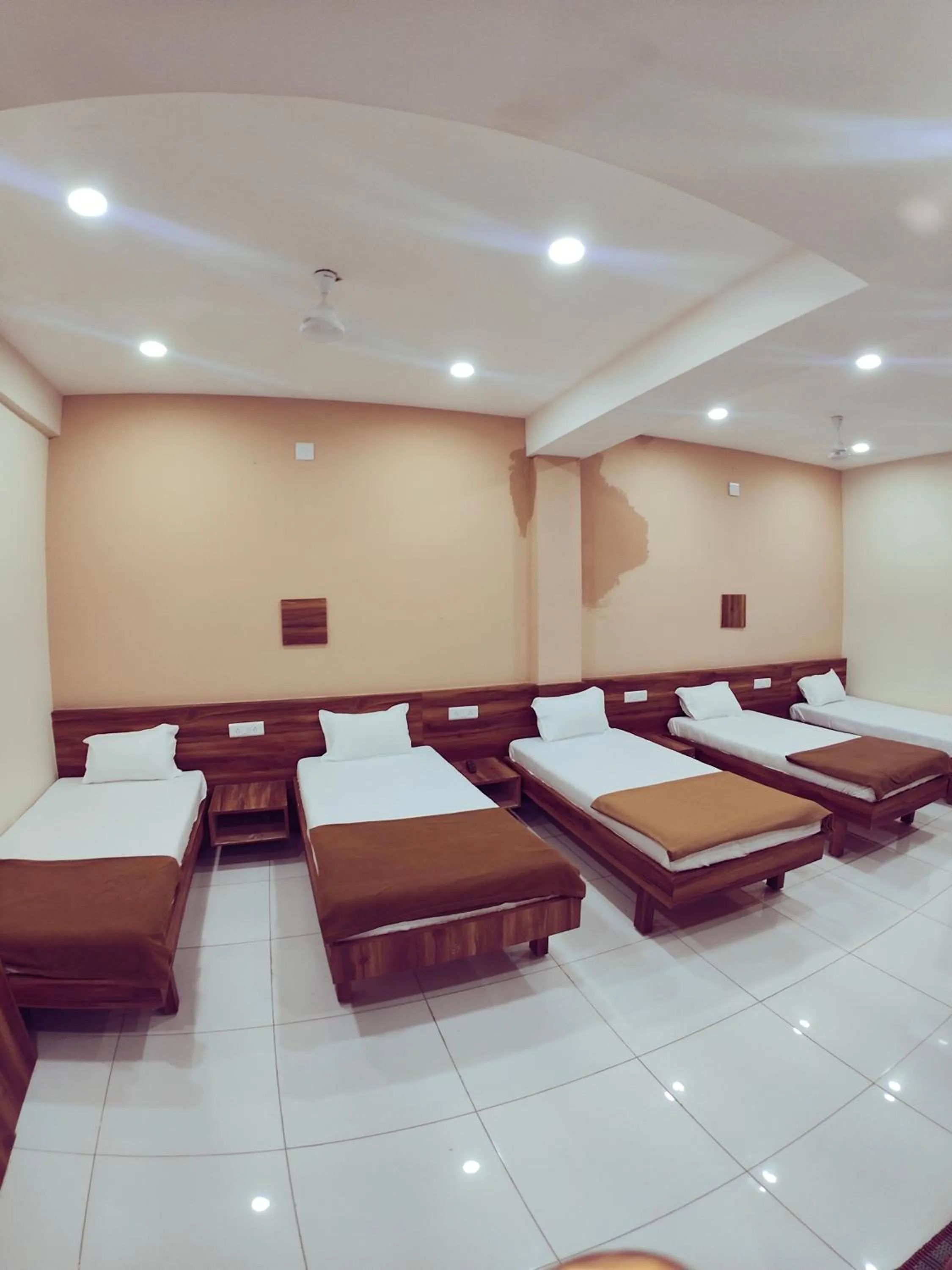 Bed in Hotel Samruddhi Residency