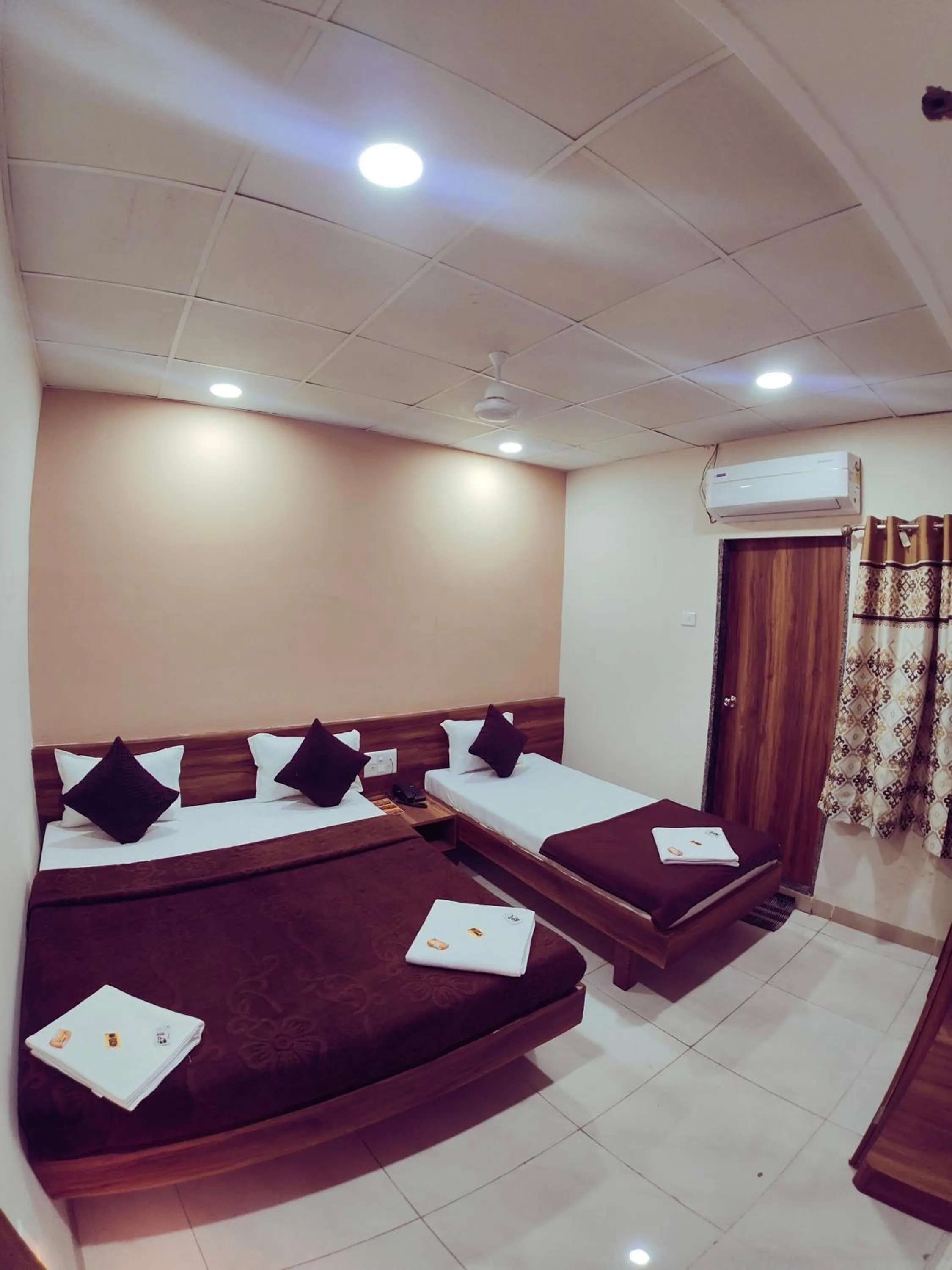 Bed in Hotel Samruddhi Residency
