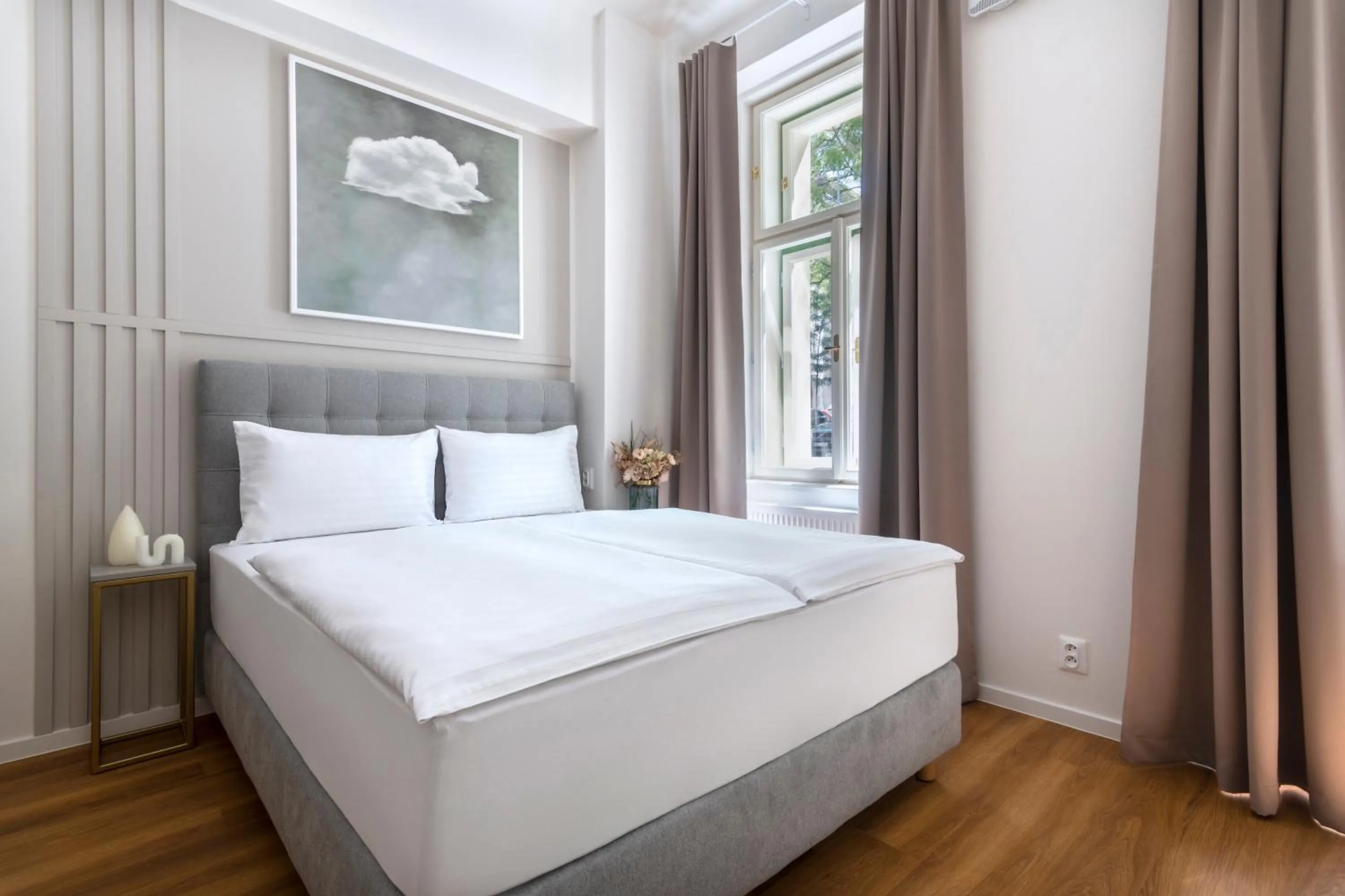 Bed in Encore Boutique Residence by Dwellfort