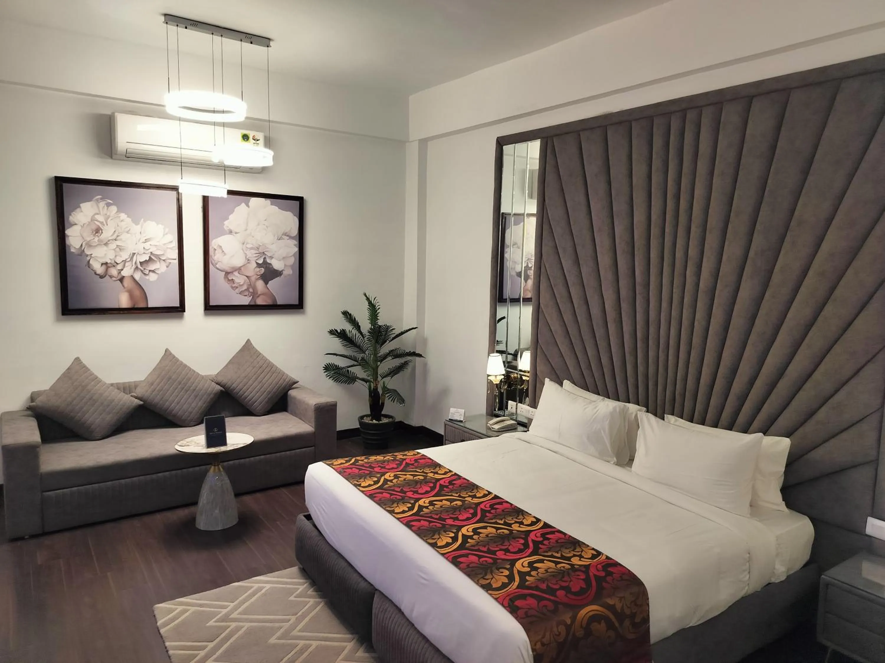 Photo of the whole room, Bed in Bel-La Monde Hotel NH8 at 6km from IGI Airport Delhi