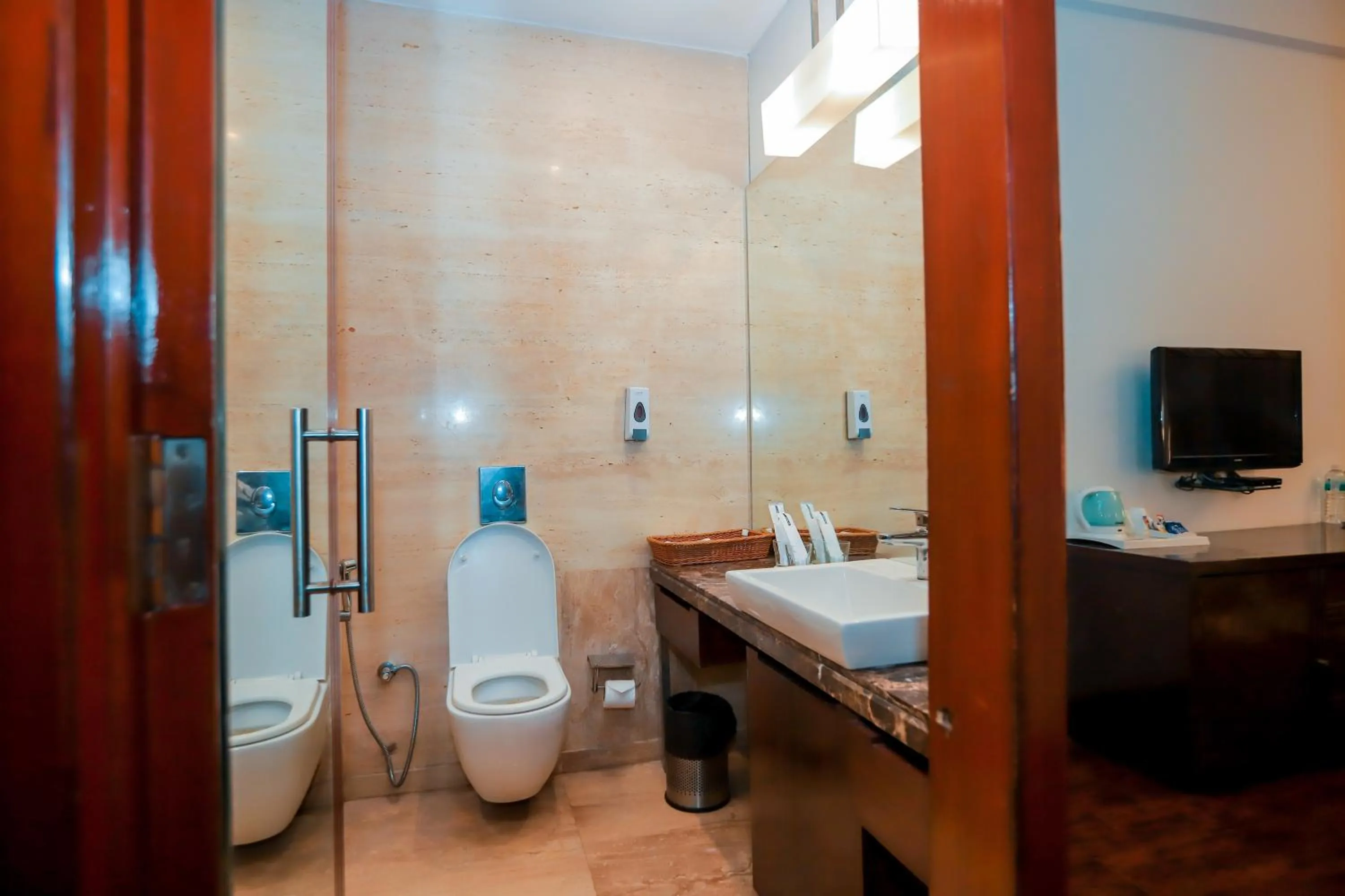 Shower in Bel-La Monde Hotel NH8 at 6km from IGI Airport Delhi