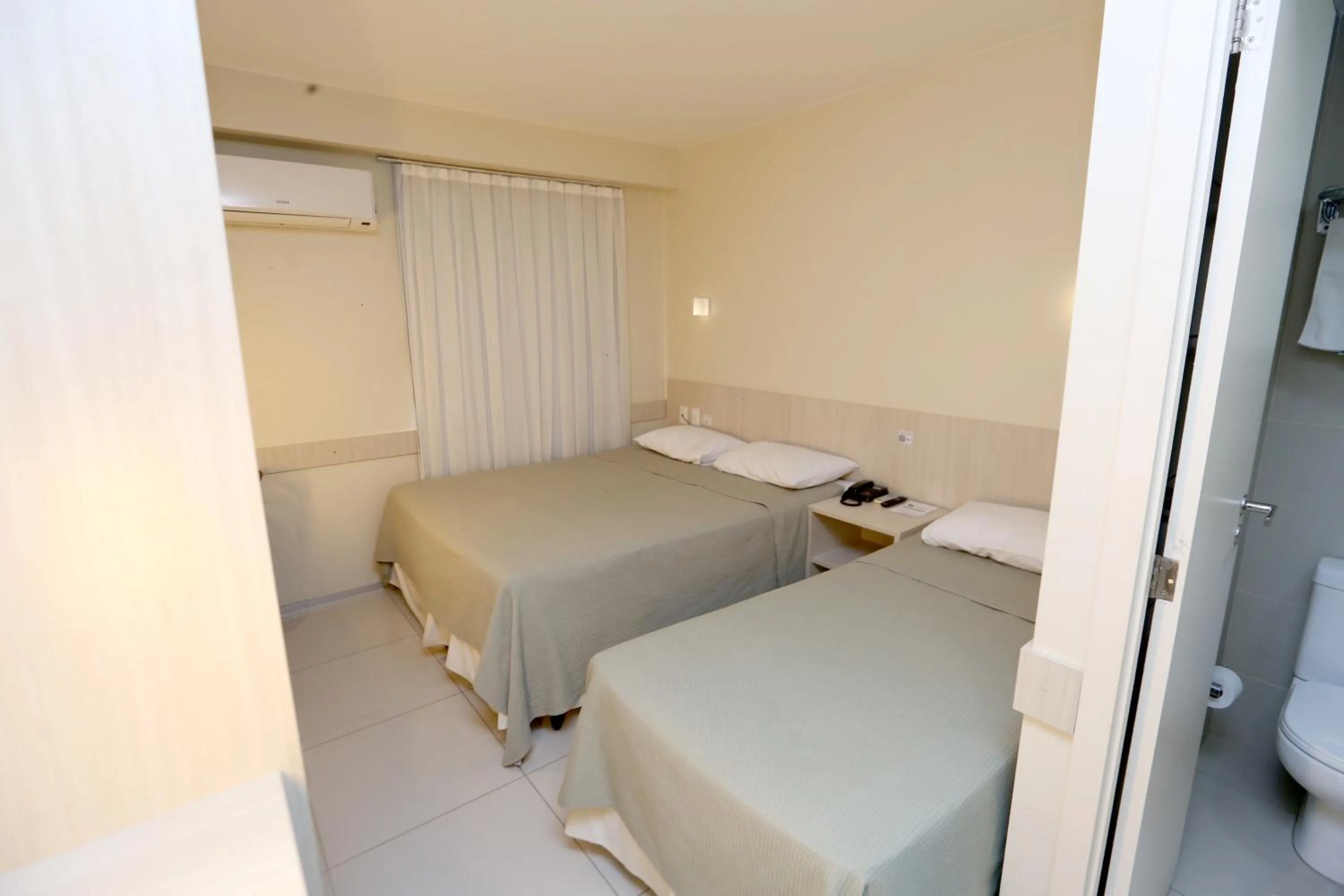 Bed in Stay Inn Hotel