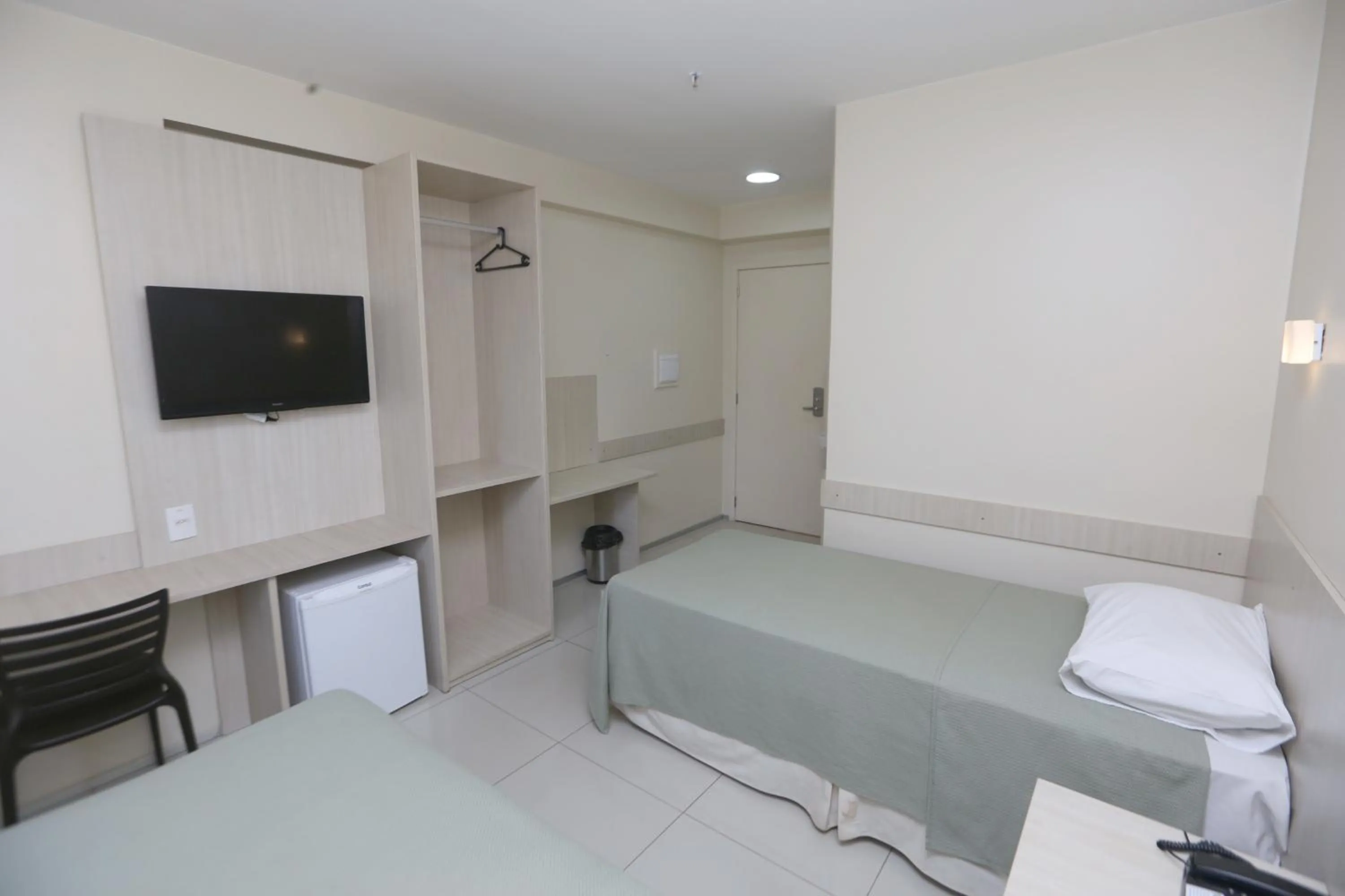 Bed in Stay Inn Hotel