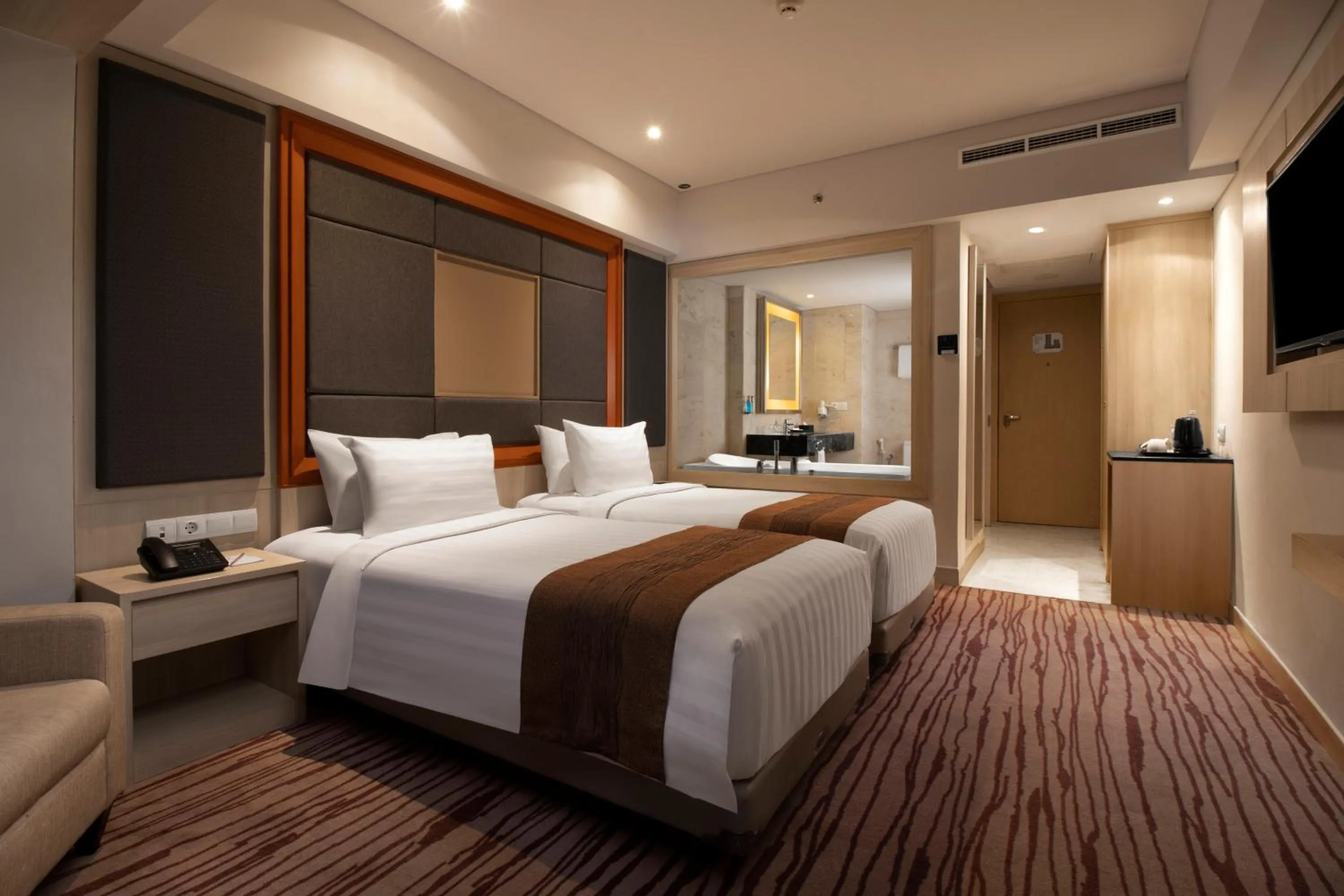 Bed in Sovereign Bali Hotel