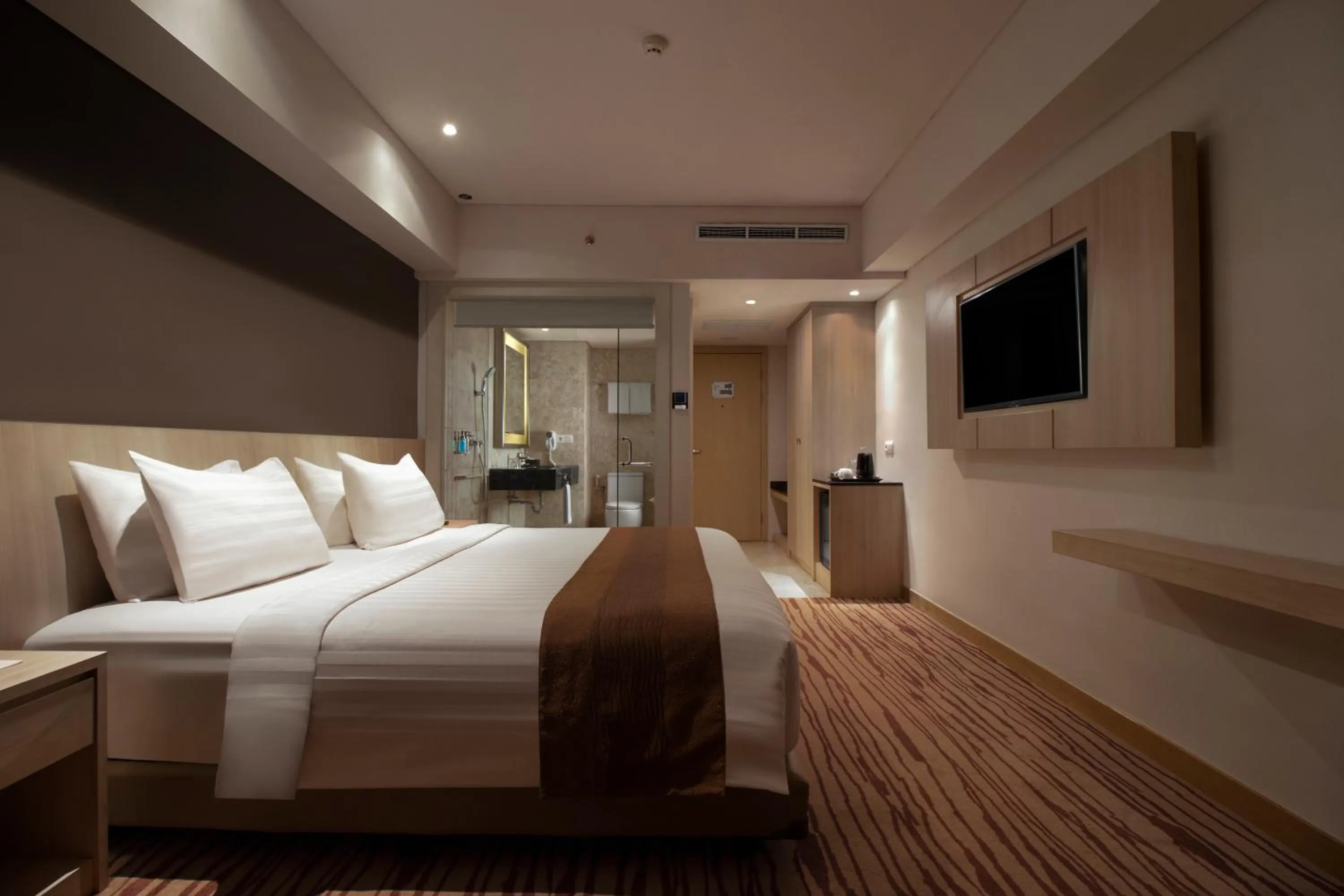 Bed in Sovereign Bali Hotel