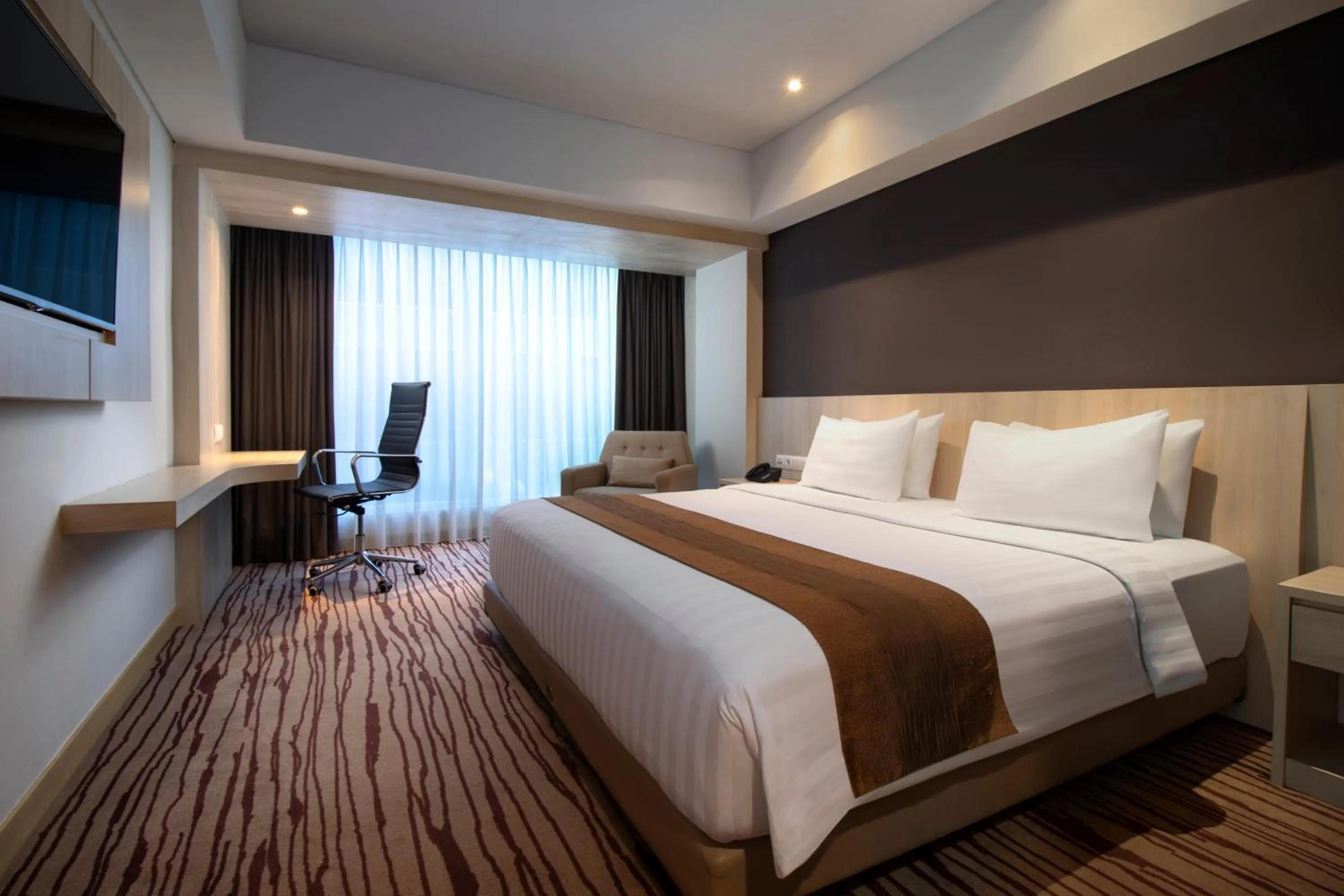 Bed in Sovereign Bali Hotel