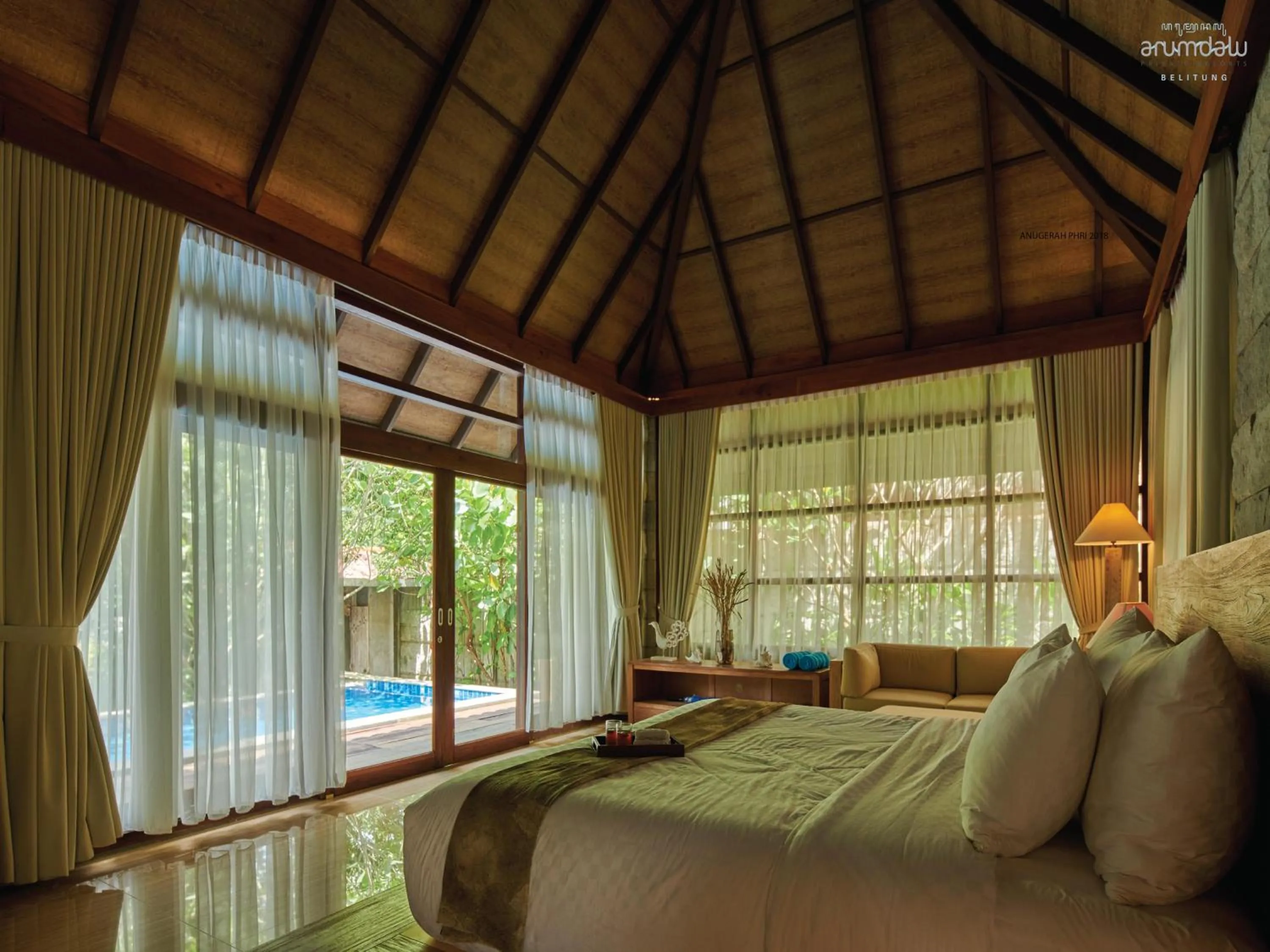 Bed in Arumdalu Private Resort