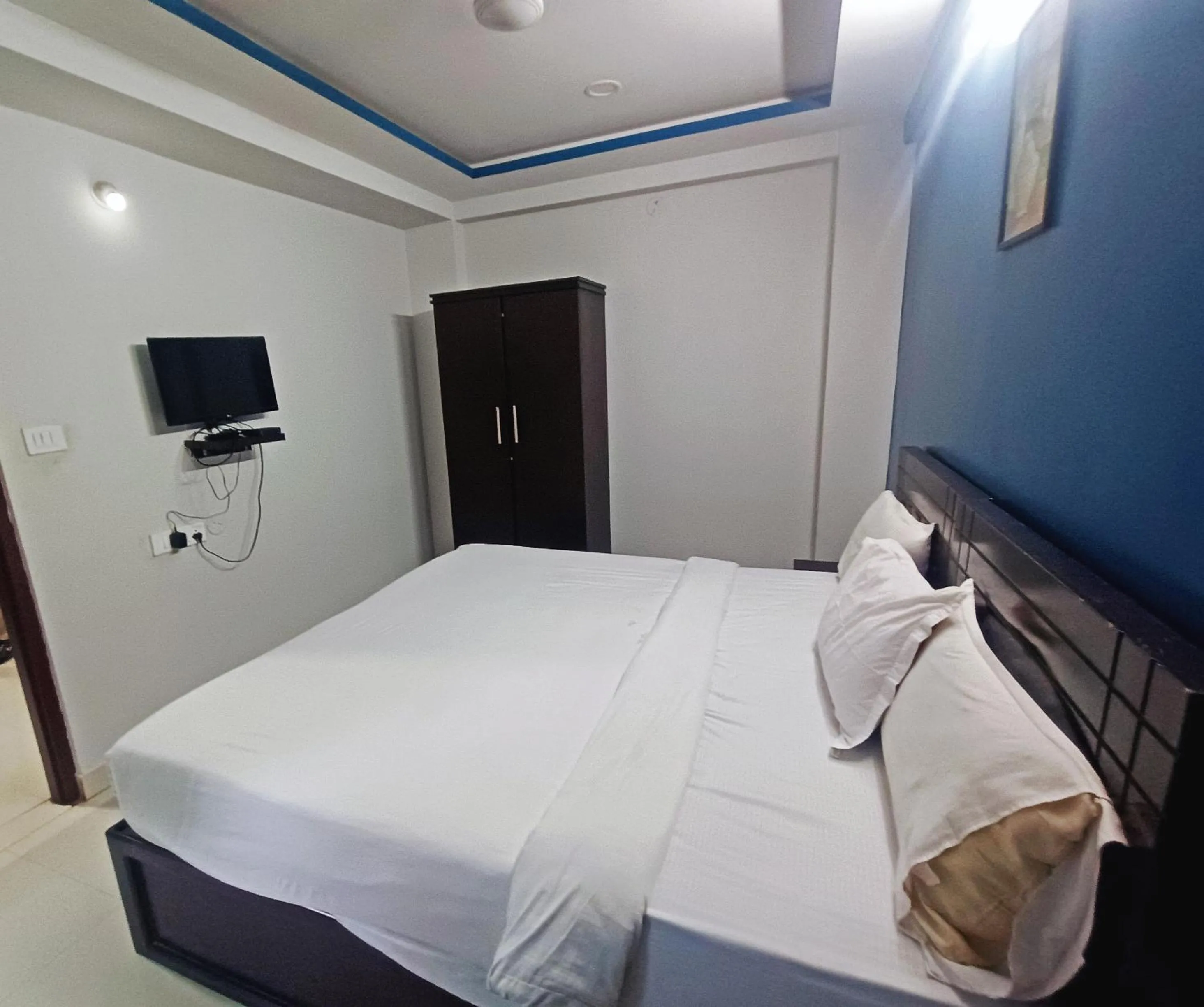 Bedroom in Delta Inn Madiwala