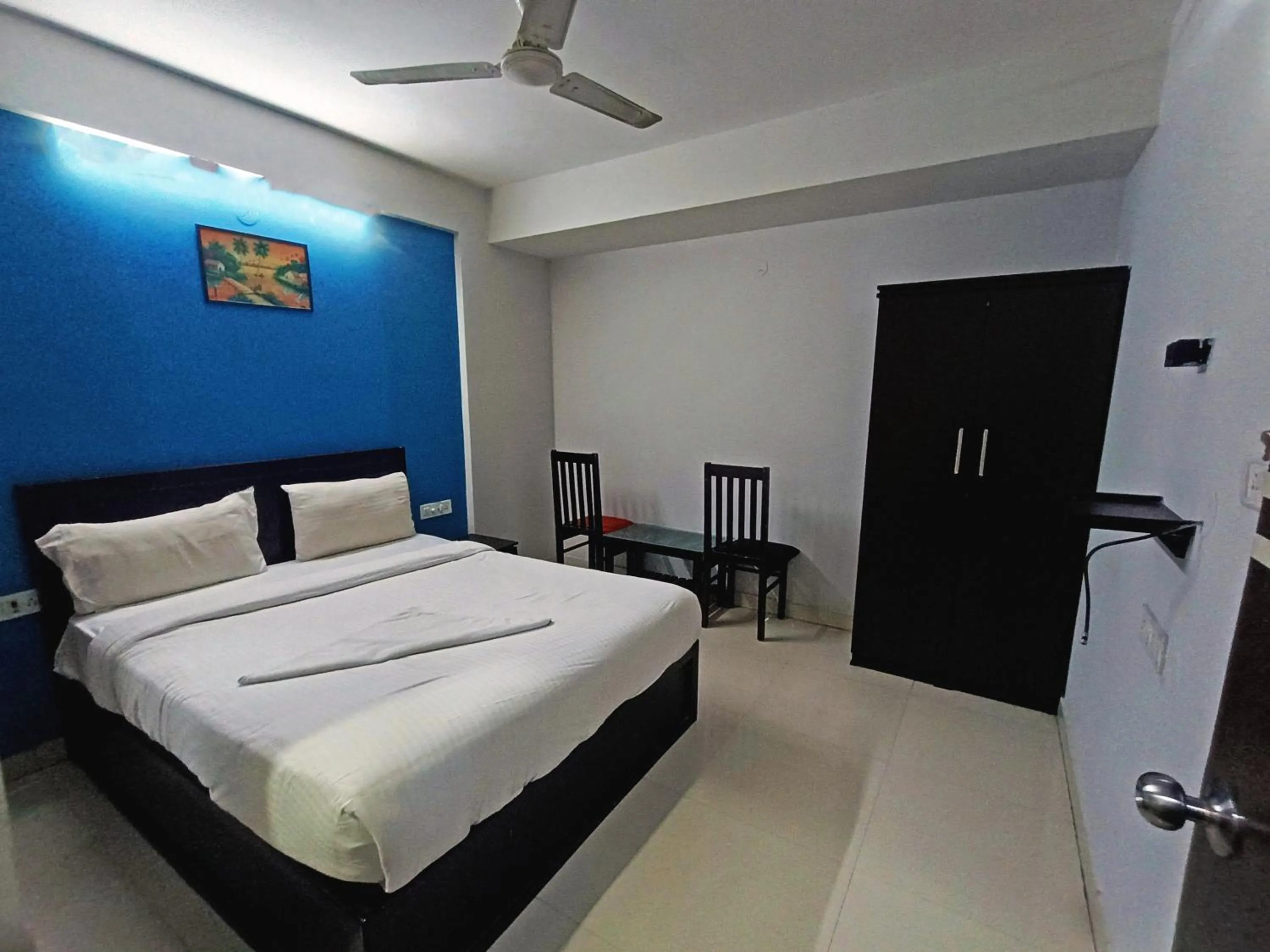 Bedroom in Delta Inn Madiwala
