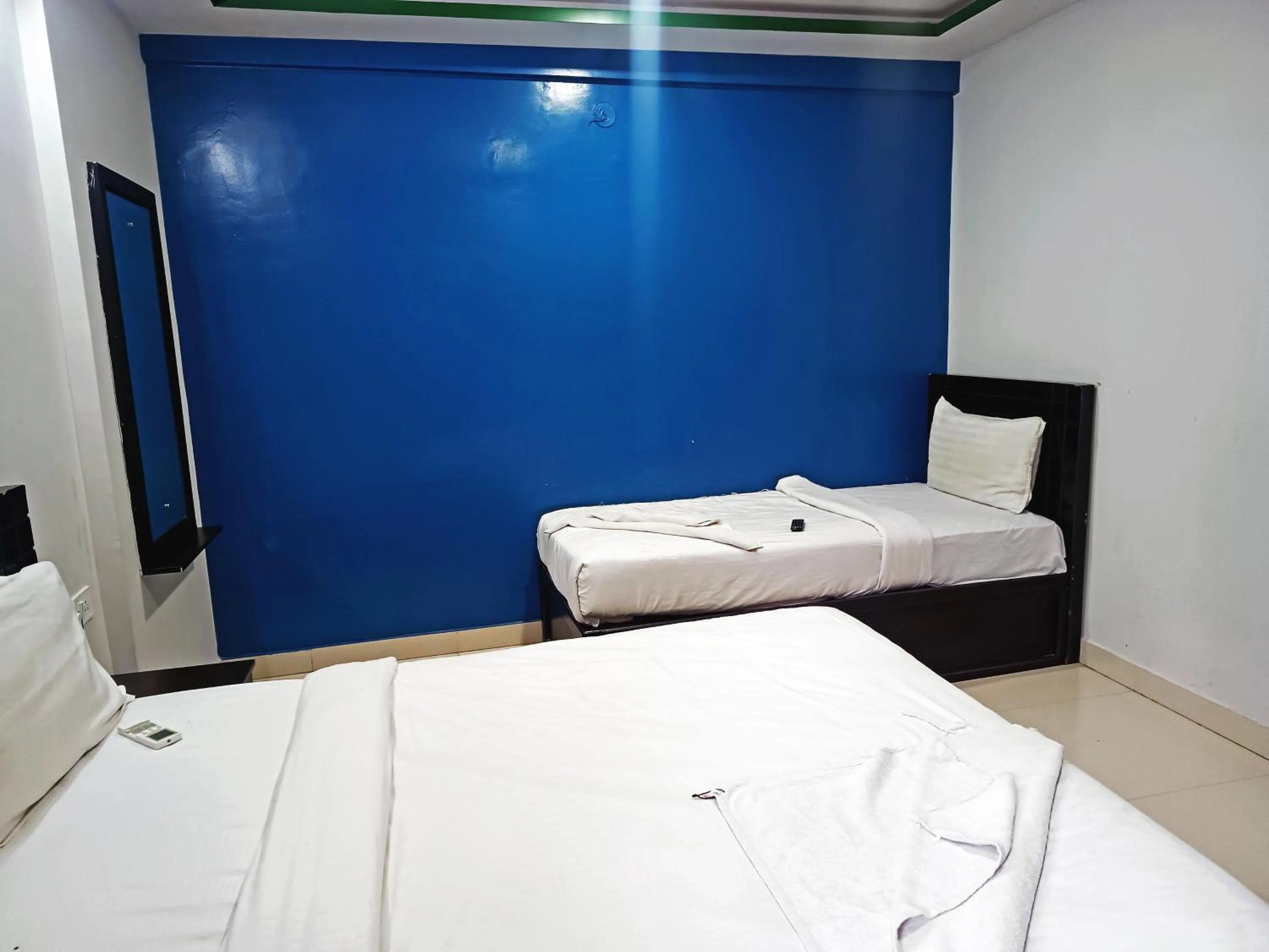 Bedroom in Delta Inn Madiwala