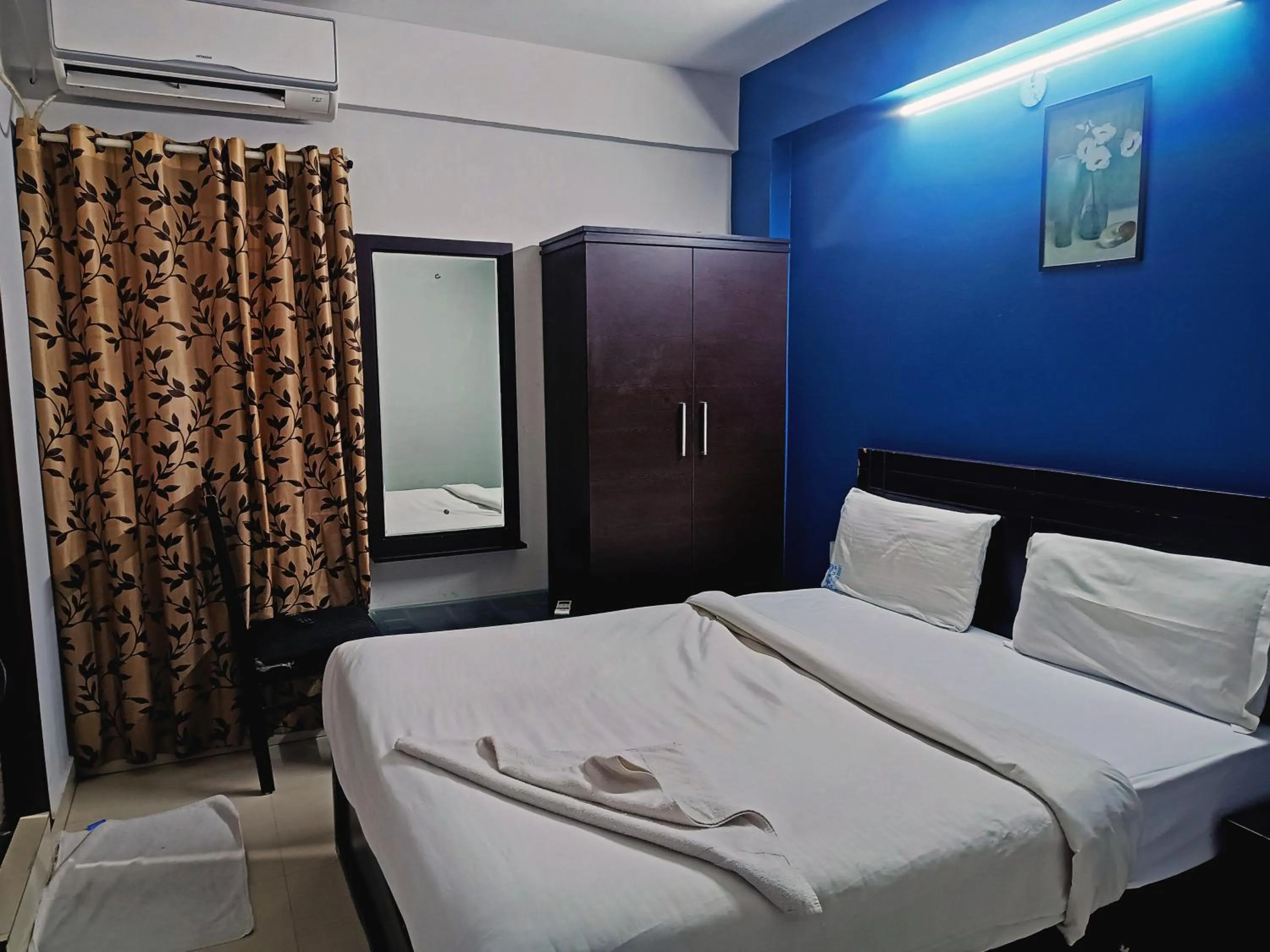 Bedroom in Delta Inn Madiwala